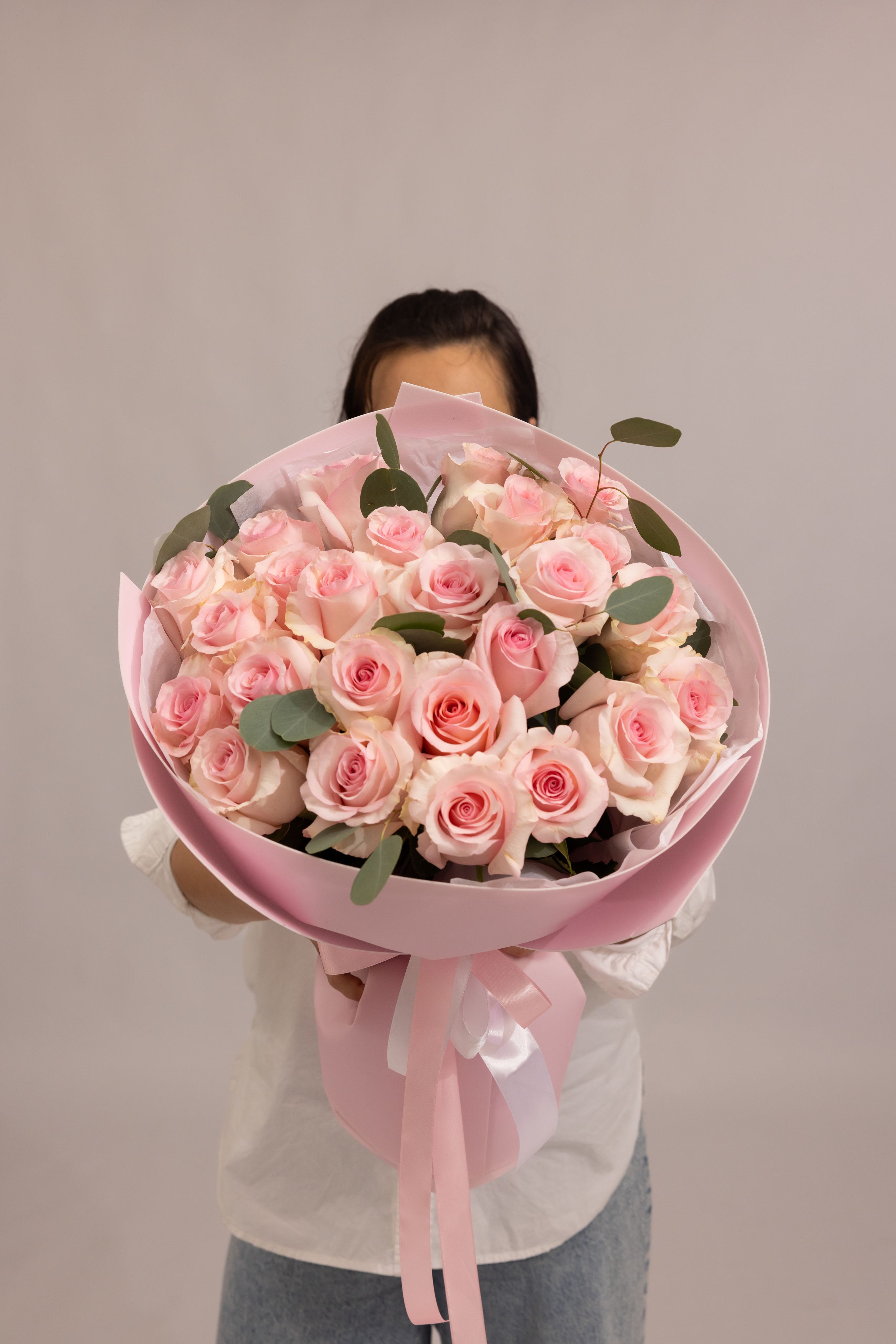 Blush Dream - A delicate bouquet of  premium roses in soft blush pink tones. Each bloom features a full, elegant form with gentle gradients of pink, creating a romantic and refined composition. The soft palette and classic round shape make this bouquet timeless and effortlessly luxurious—perfect for expressing love, admiration, and tender emotions.