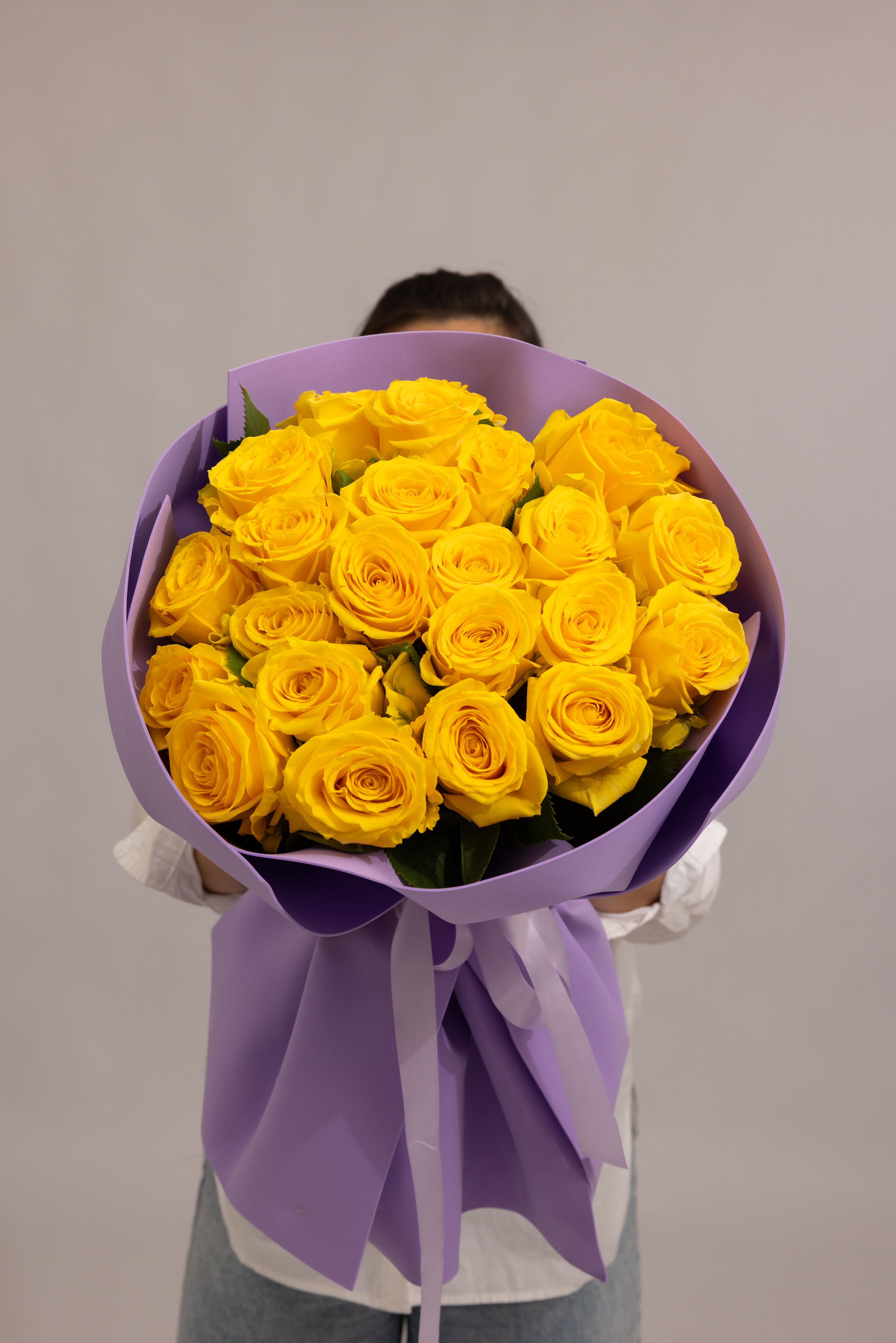 Golden Aura - A radiant bouquet of 24  roses in a rich yellow tone. Full, layered blooms create a soft yet vibrant composition that instantly brightens any space. This bouquet embodies warmth, joy, and effortless elegance—perfect for celebrations, gratitude, or simply bringing light into someone’s day.  premium  - 36 stems 
