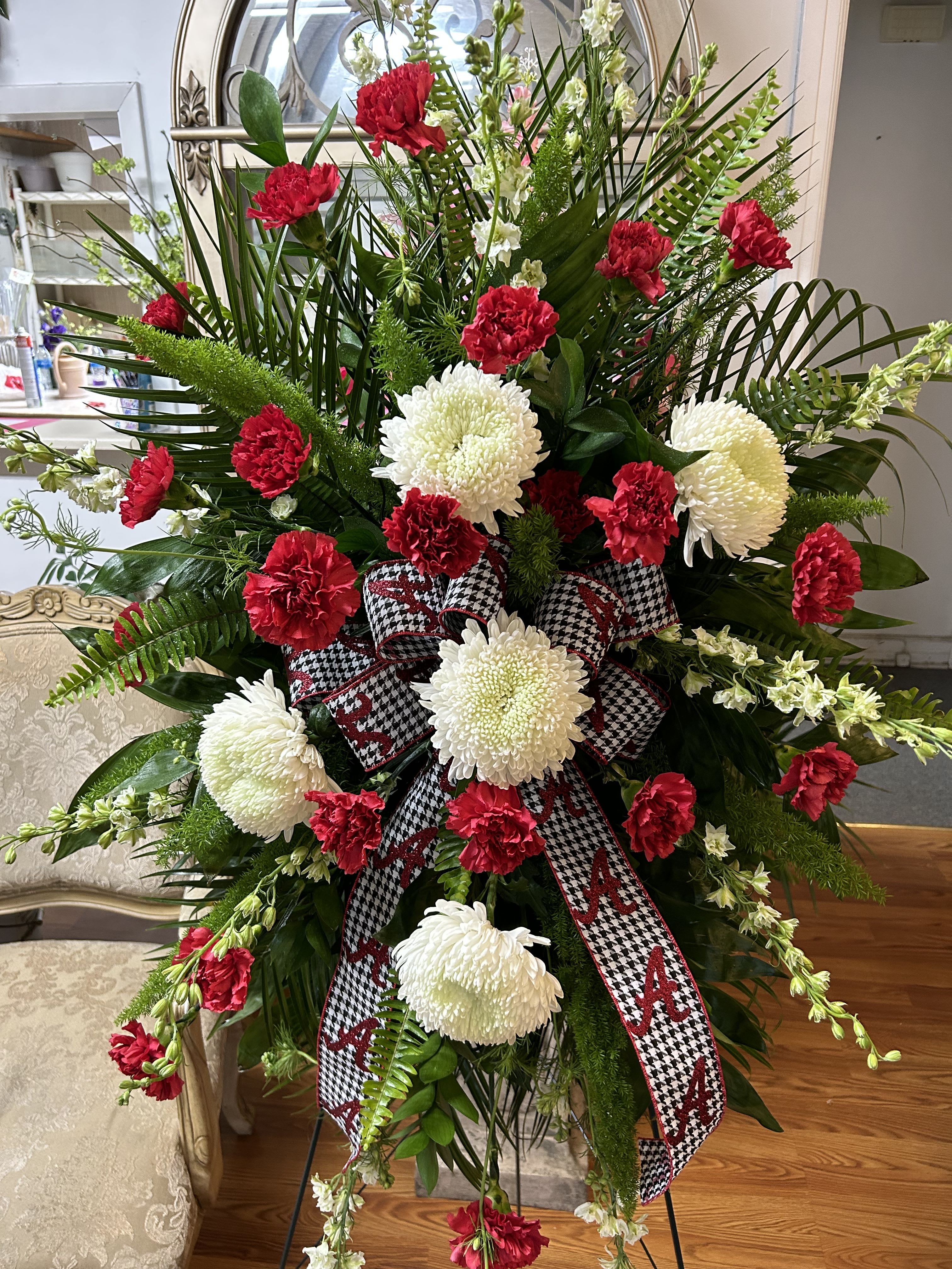 The Alabama Spray  - Standing spray of red and white flowers with houndstooth Alabama A ribbon