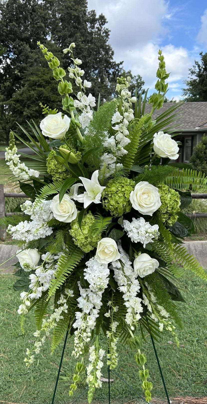 Green and white spray  - A beautiful, standing spray with assorted green and white premium flowers on a easel