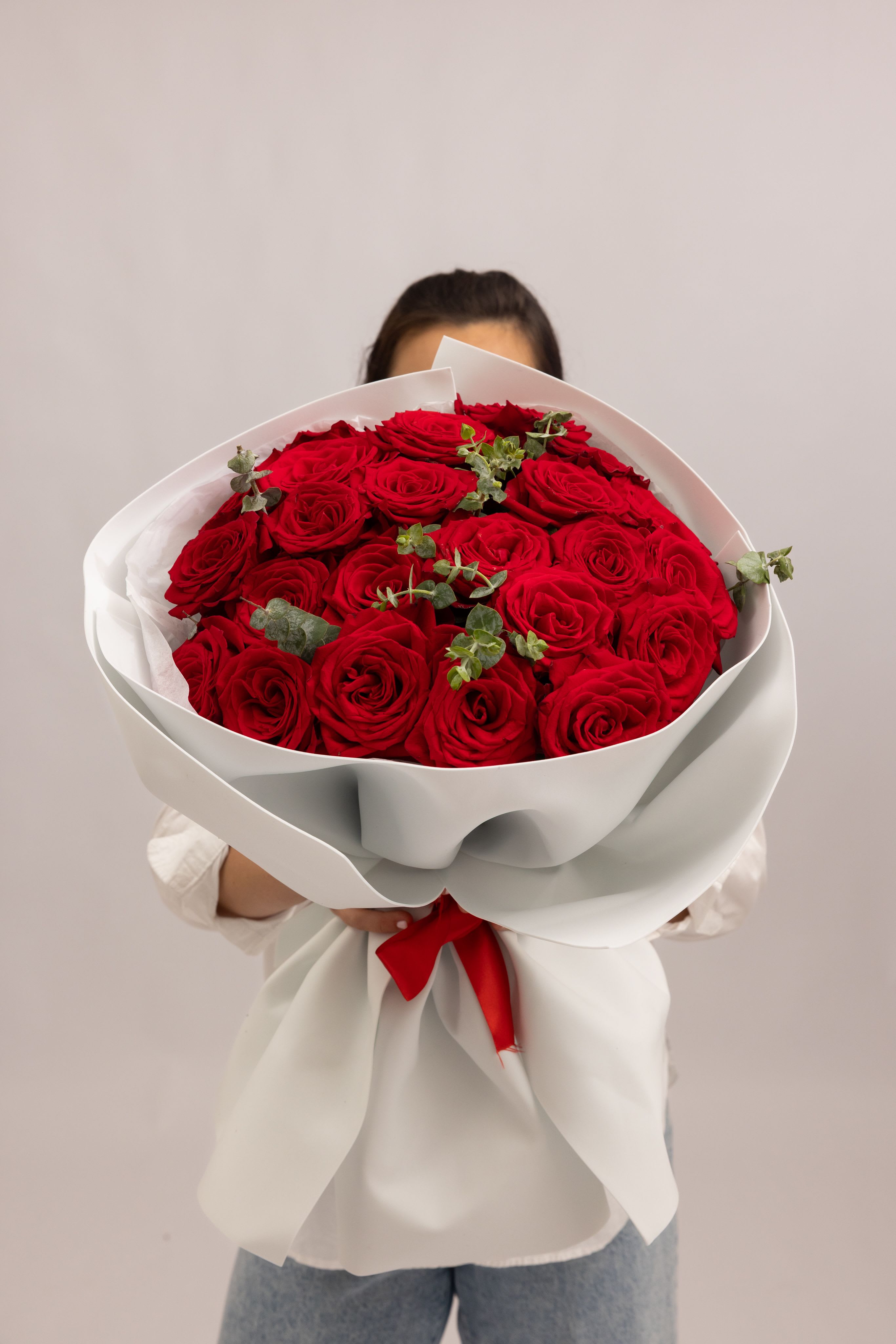 Crimson Elegance - A timeless bouquet of 24 premium red roses, each bloom rich in color and perfectly formed. The deep crimson tones create a bold and luxurious composition that embodies passion, love, and classic elegance. With its full, rounded shape and refined presentation, this bouquet is designed to make a powerful and unforgettable impression—perfect for romantic gestures and meaningful moments.