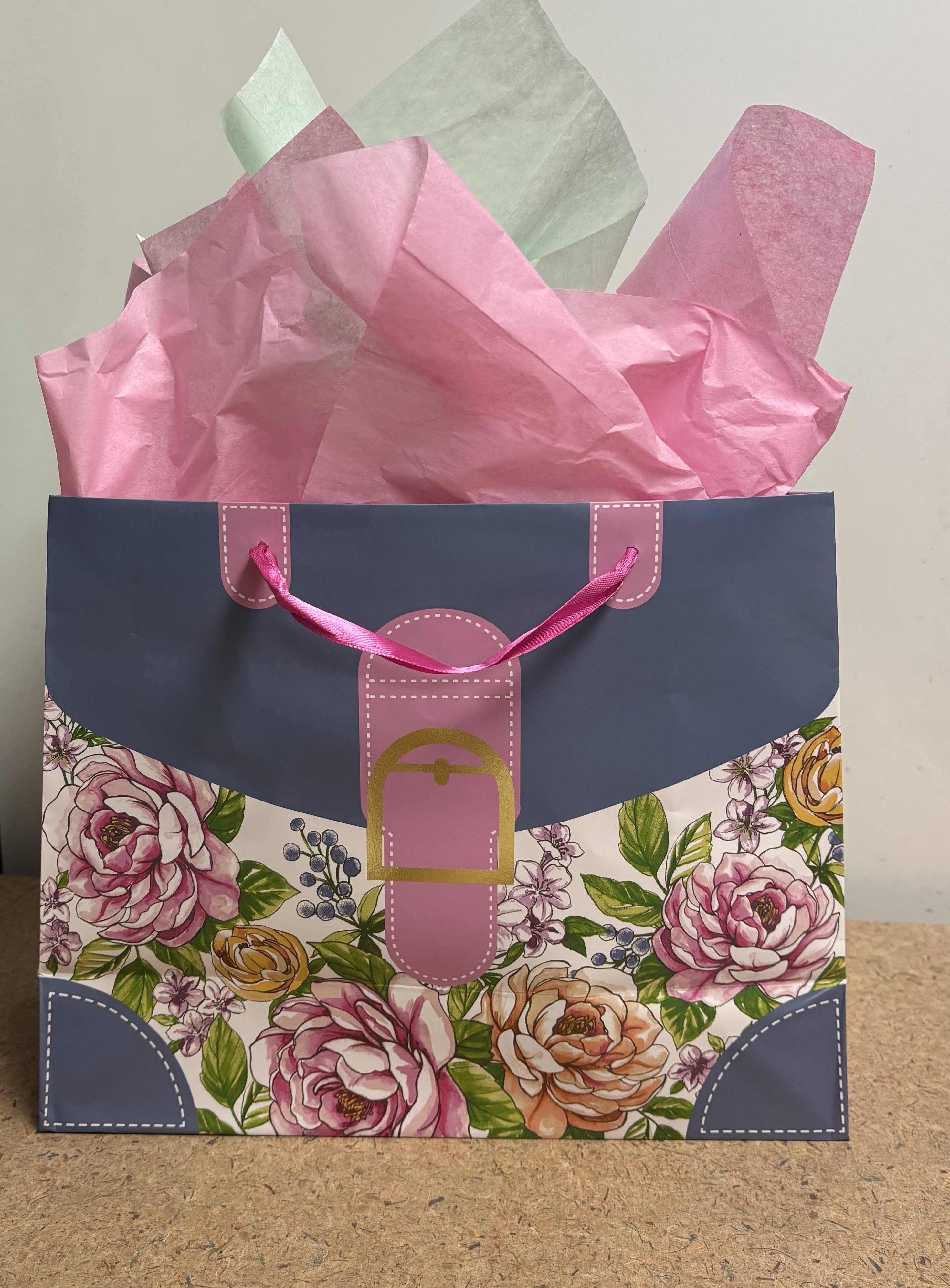 Citrus Bliss Gift Bag - This standard presentation will contain a 36 count teabag tin of Republic of Tea Earl Grey Orange Marmalade or Lemon Biscuit Tea(based on availability), a 12 oz jar of Chai Spice honey for tea, a tube of Blood Orange and Vanilla Hand Therapy and a citrus themed hand made soap all inside a beautiful floral Mother's Day Gift Bag.