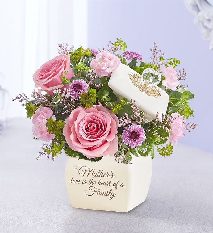Pink roses and purple flowers in a white vase with a Mother's Day message