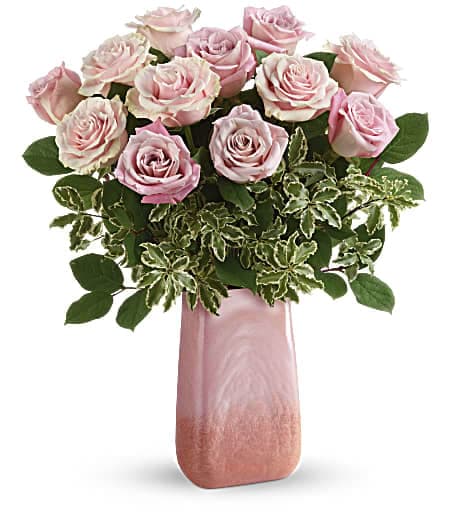 Pink roses arranged in a tall pink vase