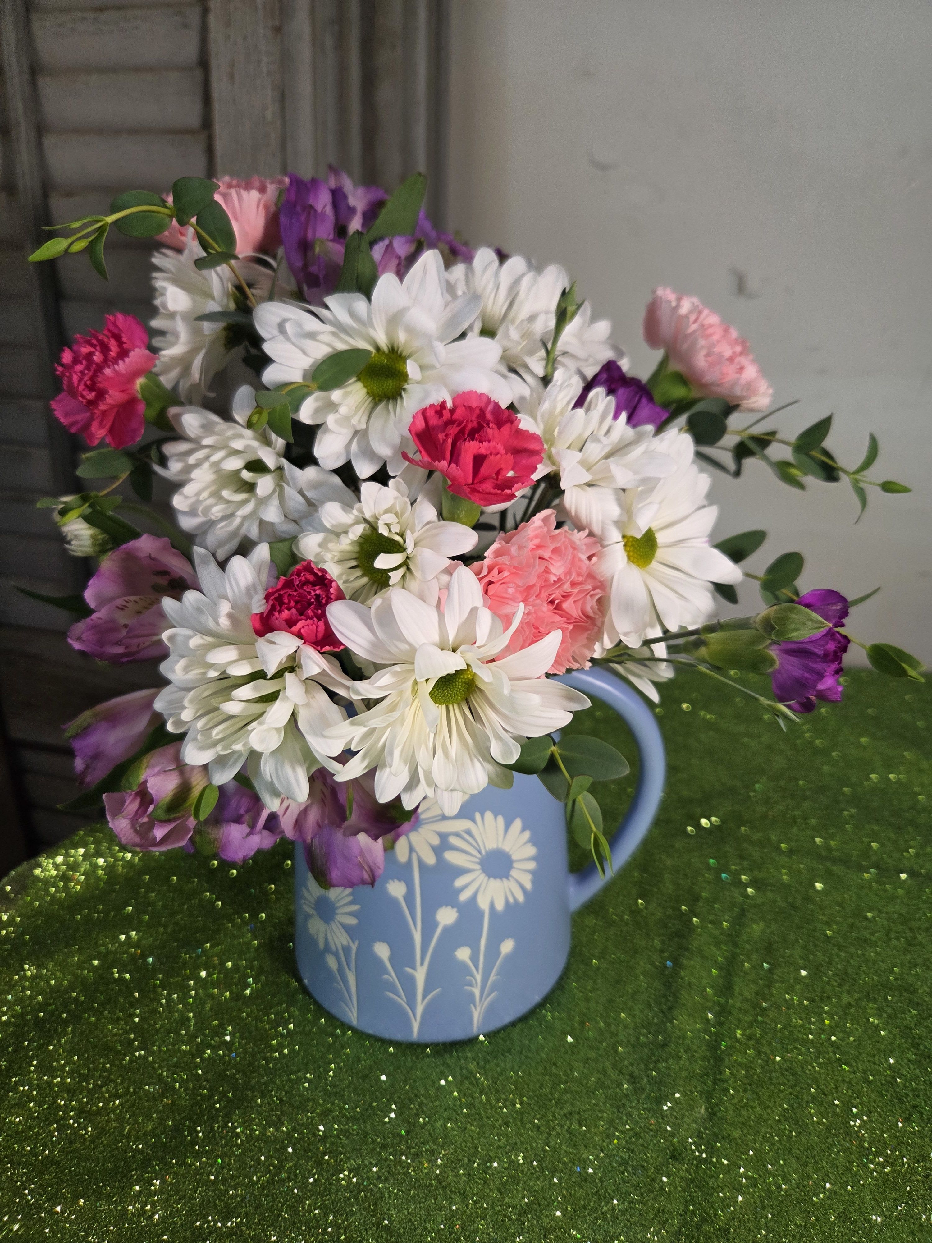 PITCHER OF DREAMS - A dreamy blue pitcher full of white daisies and other pink and purple flowers