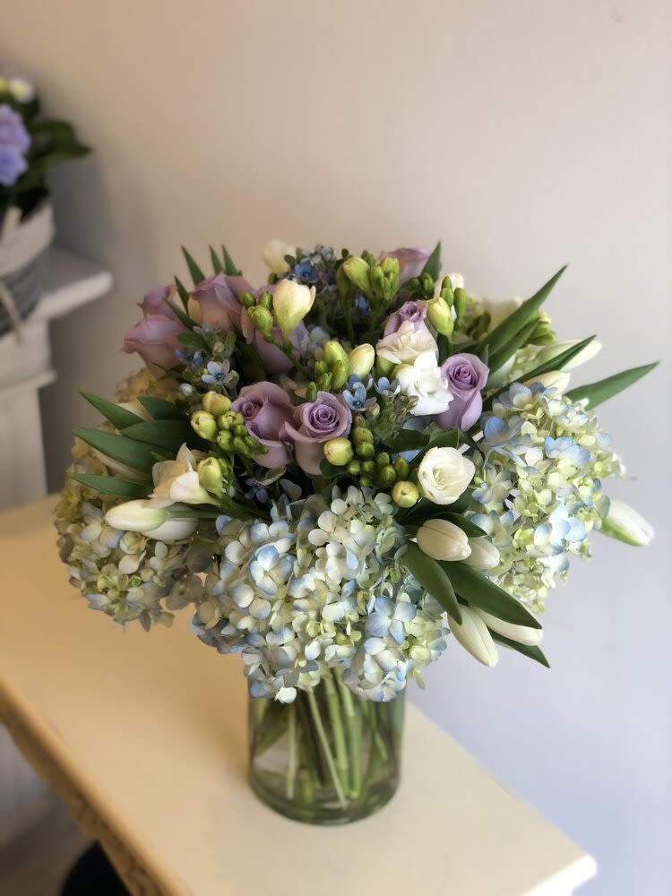 Bouquet of pastel flowers in a glass vase