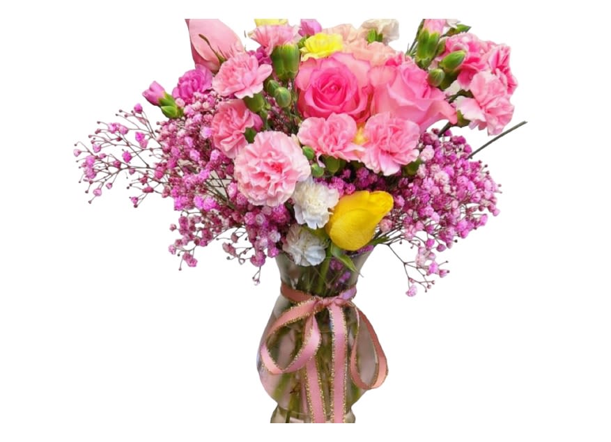 Pink bouquet with roses, carnations, and baby's breath in a glass vase