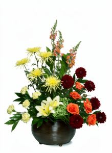 Warm Tones Flower  -  Pet Friendly? No — Chrysanthemums may be toxic to cats and dogs.  Keep out of reach; avoid homes with curious cats.   Human Allergy Note : No major allergy-triggering flowers noted.  Still, keep the bouquet in a ventilated area to minimize exposure for sensitive individuals.   Care &amp; Longevity : Trim stems 1–2″ before placing in fresh water . Change water every 2–3 days. Keep out of direct sun and heat vents. Remove fading blooms promptly to extend life.  Best Occasions &amp; Situations : - Birthday celebrations - Romantic gestures / anniversaries - Congratulations &amp; achievements - Get well / comfort gifts - New baby welcome - Just Because flowers - Mother’s Day appreciation - Summer parties   Why Customers Love It : - Vibrant, fiery colors that brighten any room - Dense, lush design with visual impact - Fresh, hand-selected blooms - Versatile for multiple occasions - Convenient same-day delivery in Nashville