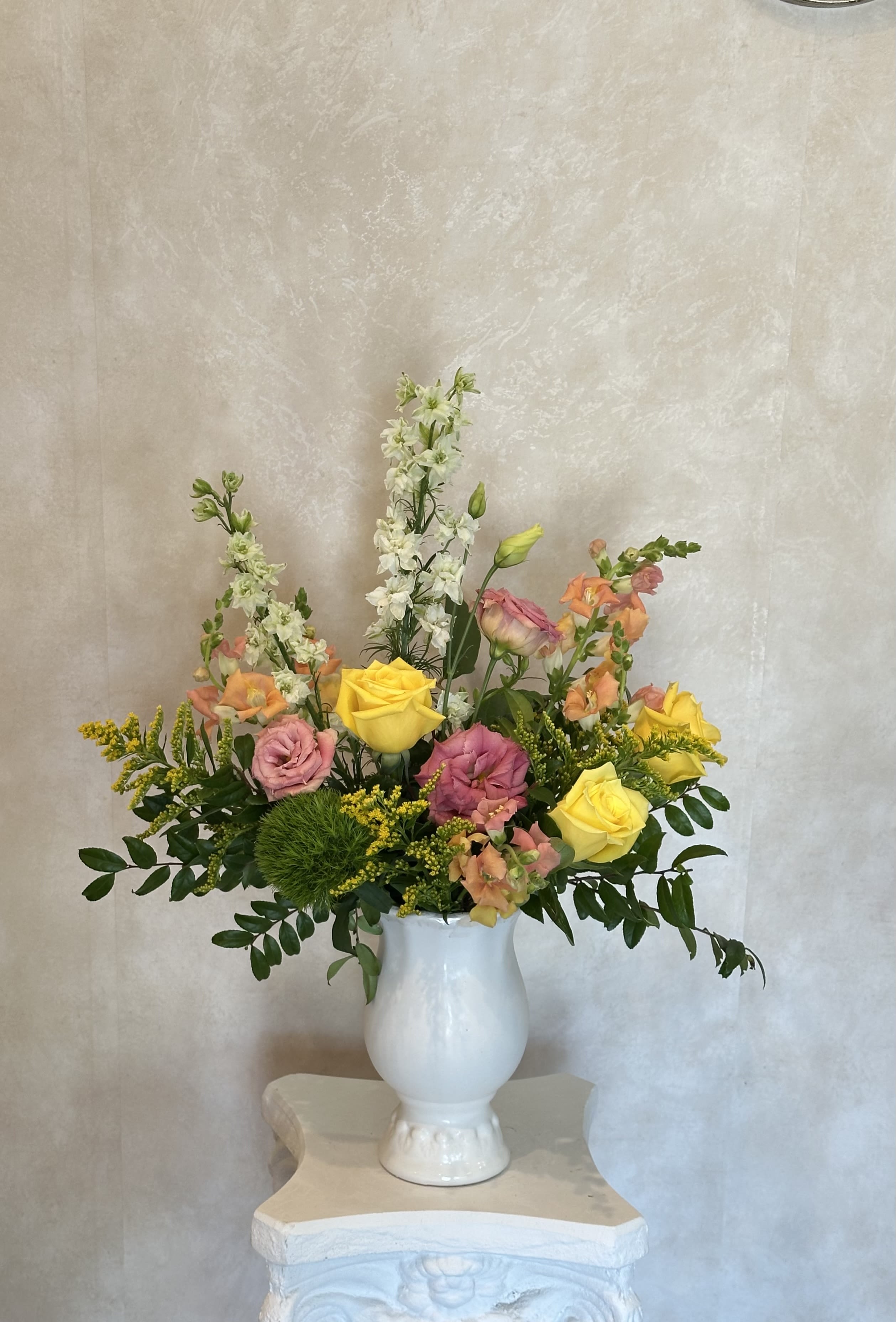 María by Musa Bloōms - A STUNNING CERAMIC VASE ARRANGEMENT FEATURING PINK LISIANTHUS, SNAPDRAGON, ROSES, DIANTHUS AND LARKSPUR. 