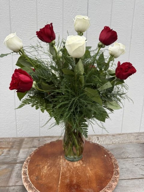 Aggie Dozen Roses - THE Aggie special - twelve long-stemmed premium roses, 6 maroon and 6 white, designed in a vase with lush accentuating greenery. This is the arrangement for your Aggie, whoop!  Deluxe adds complimenting accent flowers....white, of course!  Premium adds 4 stems of Oriental lilies to the deluxe version, we always add white as long as they are available, big, pretty and Aggie for sure!