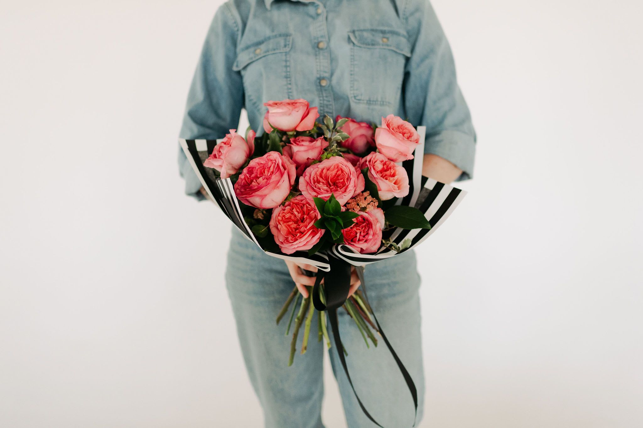 Spring Special One Dozen Roses - A soft, lush pink hand-tied bouquet featuring premium roses. Simple, classic, timeless!  If you have a preference for another variety or color of rose, please let us know in the order notes, and we will try to accommodate, depending upon availability.