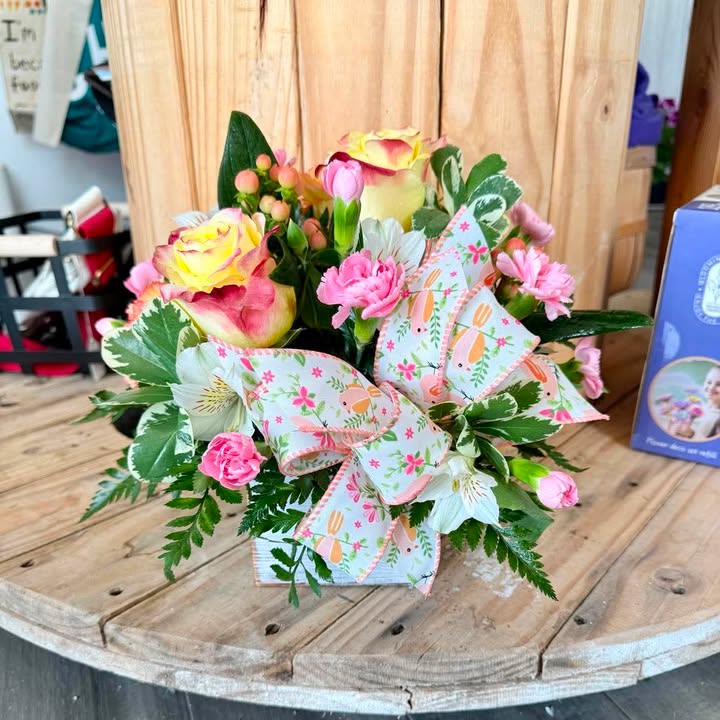 Picked for You - Soft pink and sunny yellow roses paired with pink carnations and white alstroemeria create a cheerful, compact flower arrangement perfect as a Mother's Day bouquet, anniversary surprise, or just-because pick-me-up. Presented in a decorative gift box with variegated greenery and a large pastel patterned ribbon, this mixed-color arrangement reads fresh and springlike-ideal for graduations, new babies, housewarmings, or to say "I'm thinking of you" with warmth.  Flowers are closely layered for a full, textured look that highlights the creamy peach and green accents among the blooms. The combination of roses, carnations, and alstroemeria gives a mix of soft petals and delicate trumpet shapes that feel both refined and casual, making it equally suited to get-well wishes, retirement celebrations, or a heartfelt "I'm sorry." The gift box format keeps blooms neatly arranged for easy display on a bedside table, entry console, or office desk.  Thoughtfully designed for gifting, this arrangement makes the recipient feel genuinely celebrated-whether it's for Love and Romance, Mother's Day, Springtime cheer, or Administrative Professionals' Week. Care is simple: keep in a cool spot out of direct sunlight and replenish water as needed to enjoy the fresh look for several days.  *Colors may vary due to availability*
