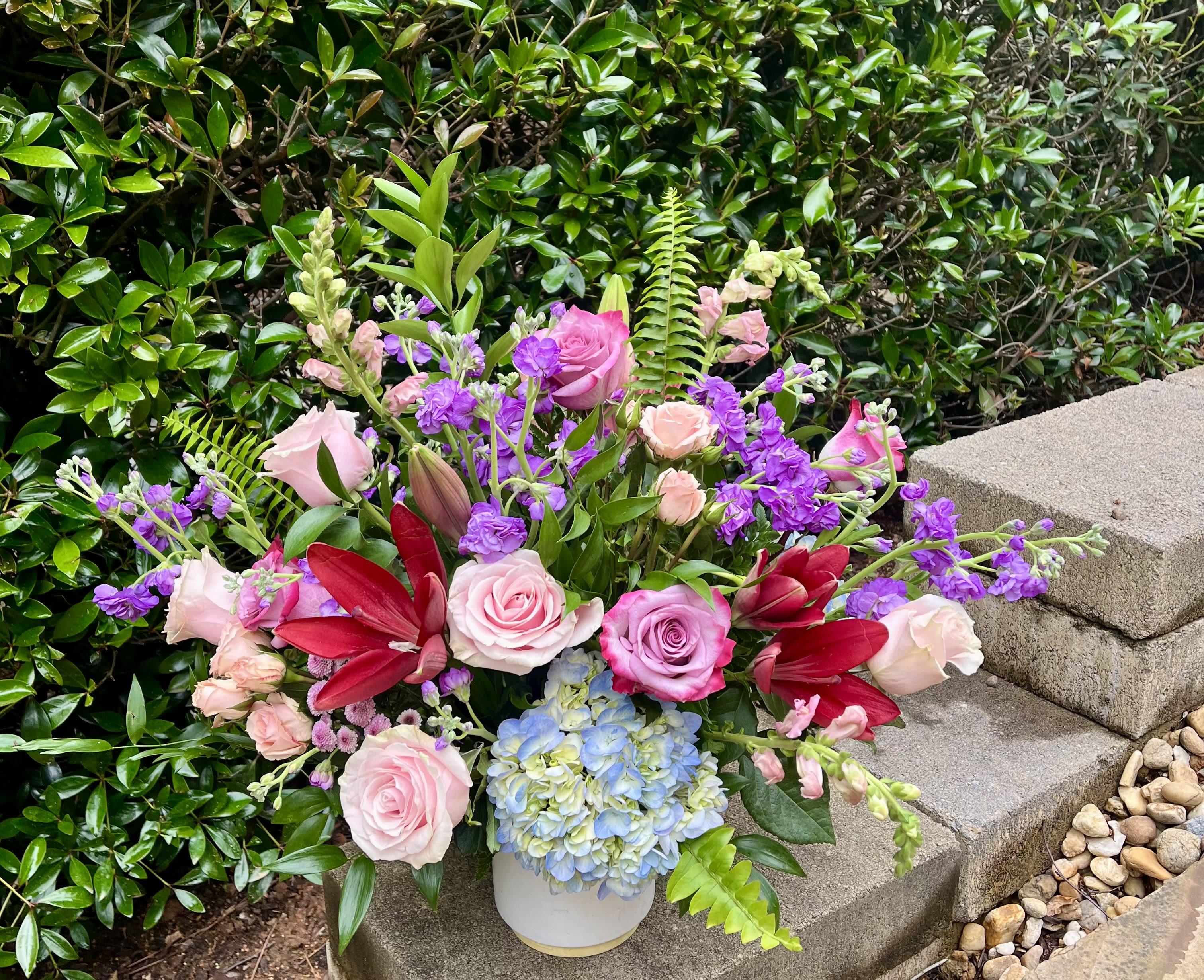 Wonderland - Fantastical lilies, enchanting hydrangea, and whimsical roses come together to create a memorization of a bouquet. This true piece of art makes an exquisite gift for a special day, moment and so much more.