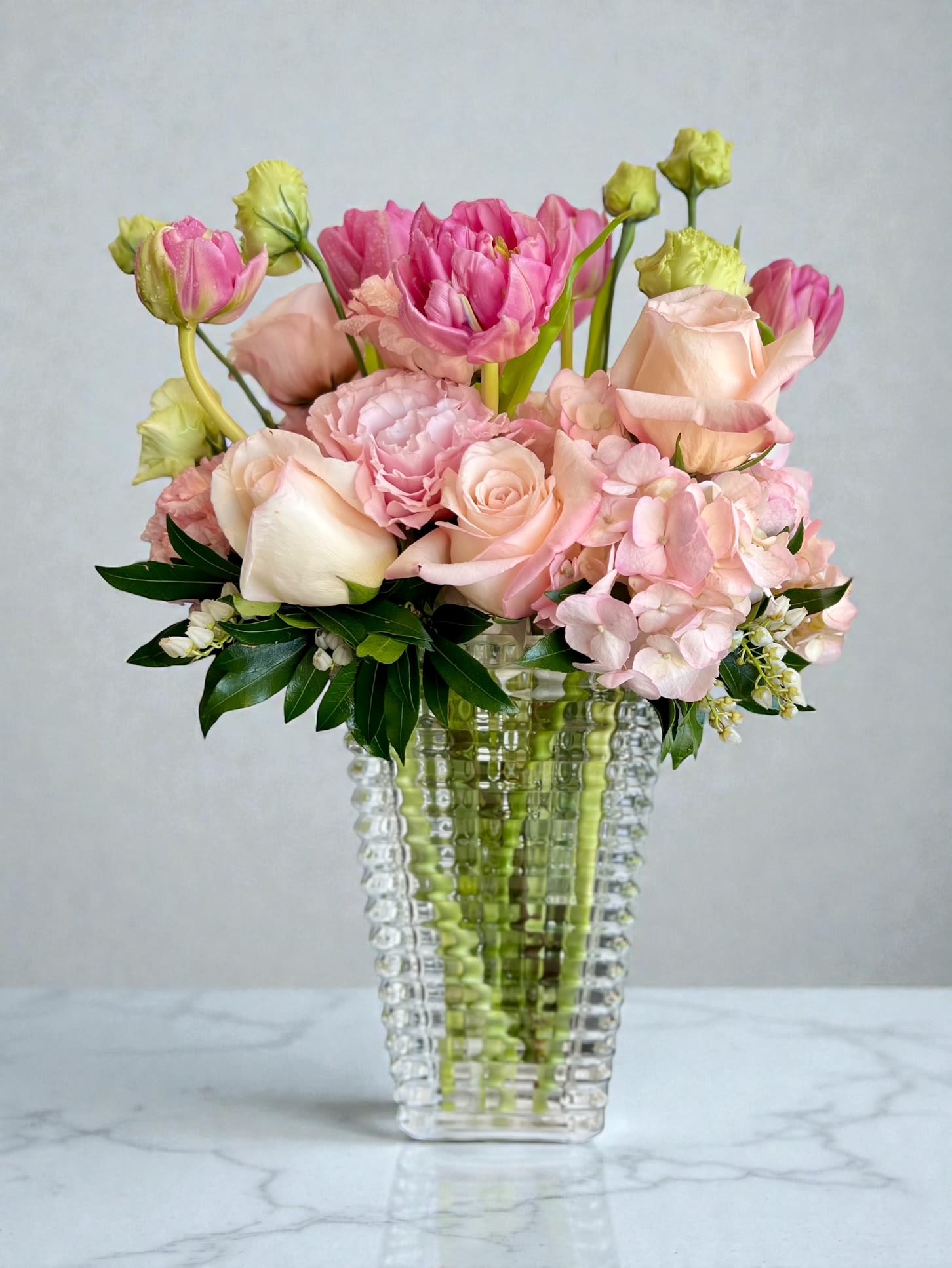 Pink Sparkle - Beautiful seasonal pink flowers displayed in a gorgeous cut glass vase.