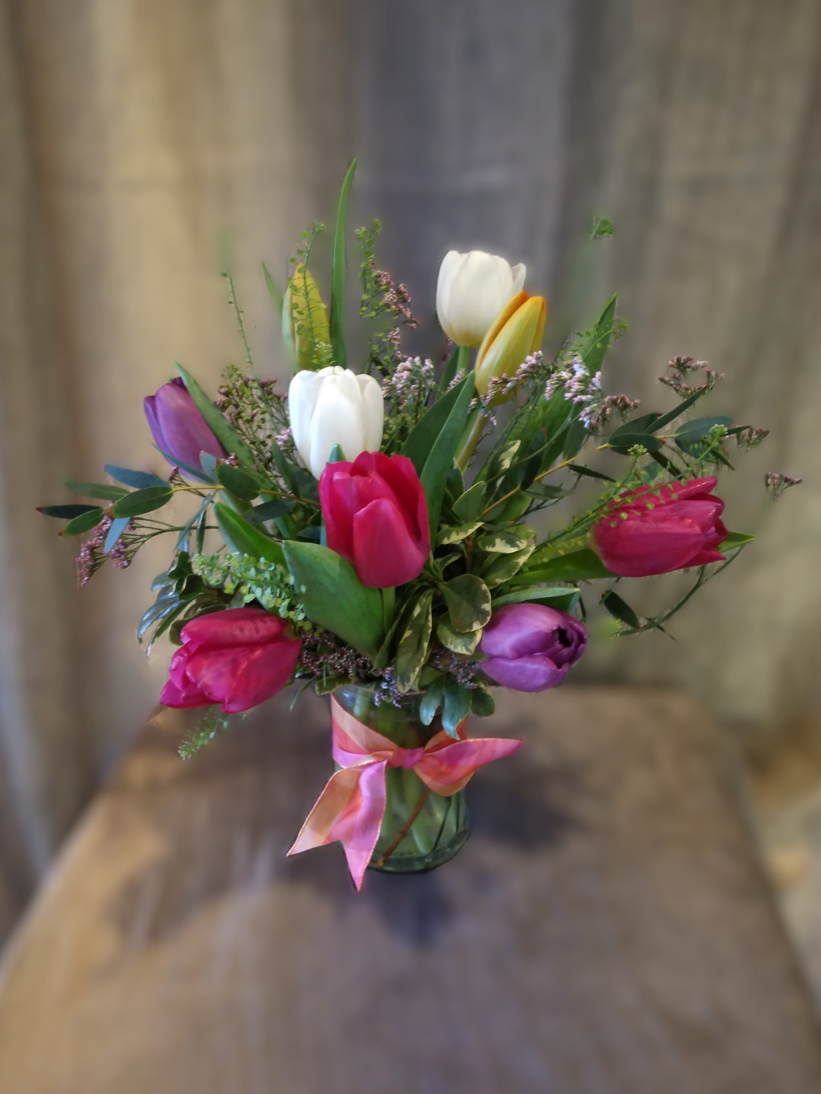 Tulips Tulips Tulips - 'Tulips Tulips Tulips' features a clear molded glass vase, foliage and you guessed it, Tulips! 