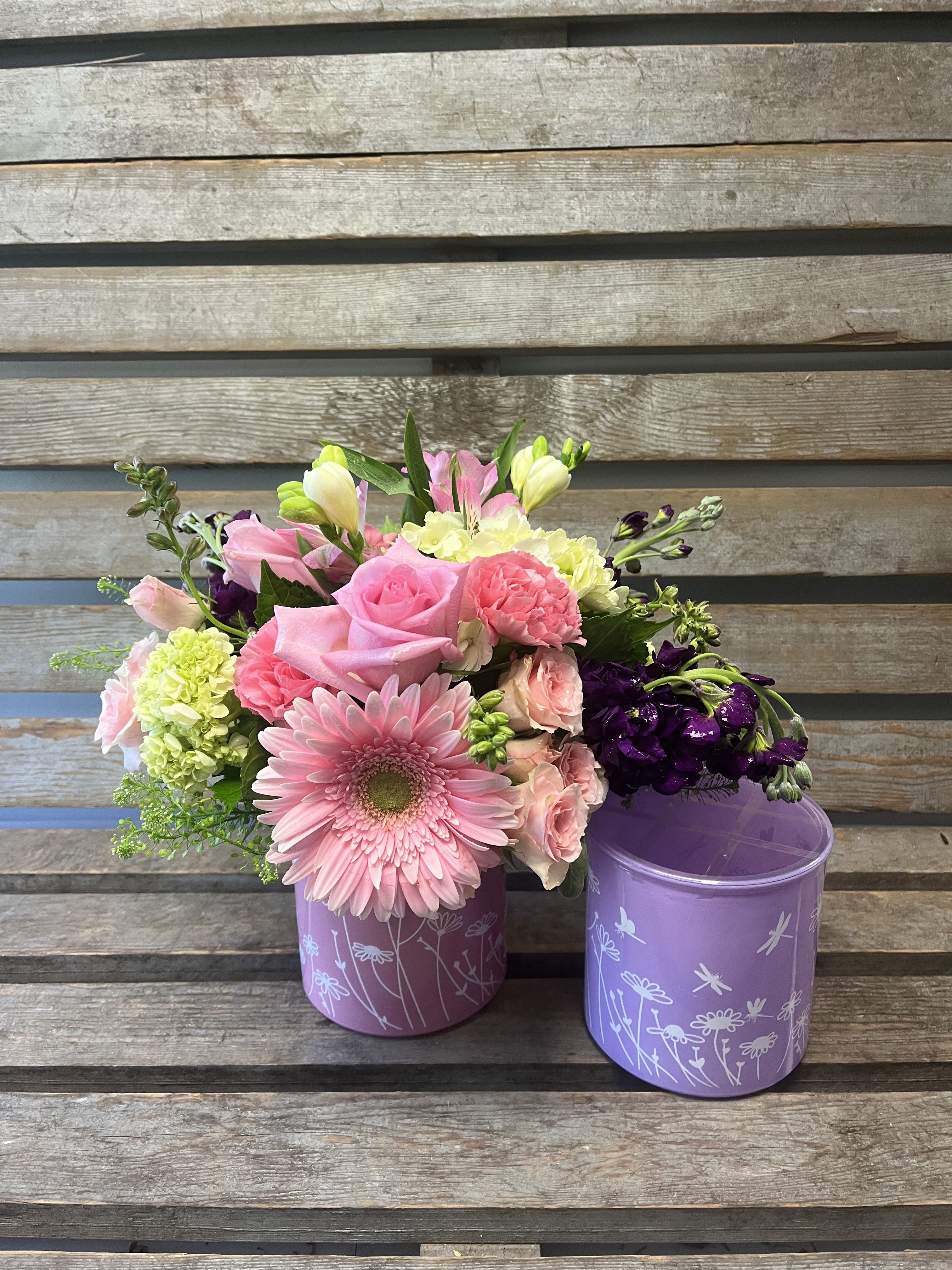Dragonfly cylinder ( designer's choice of pastel flowers )  - Pink or lavender cylinders with dragonflies filled with designers choice of pinks , lavenders and whites.  