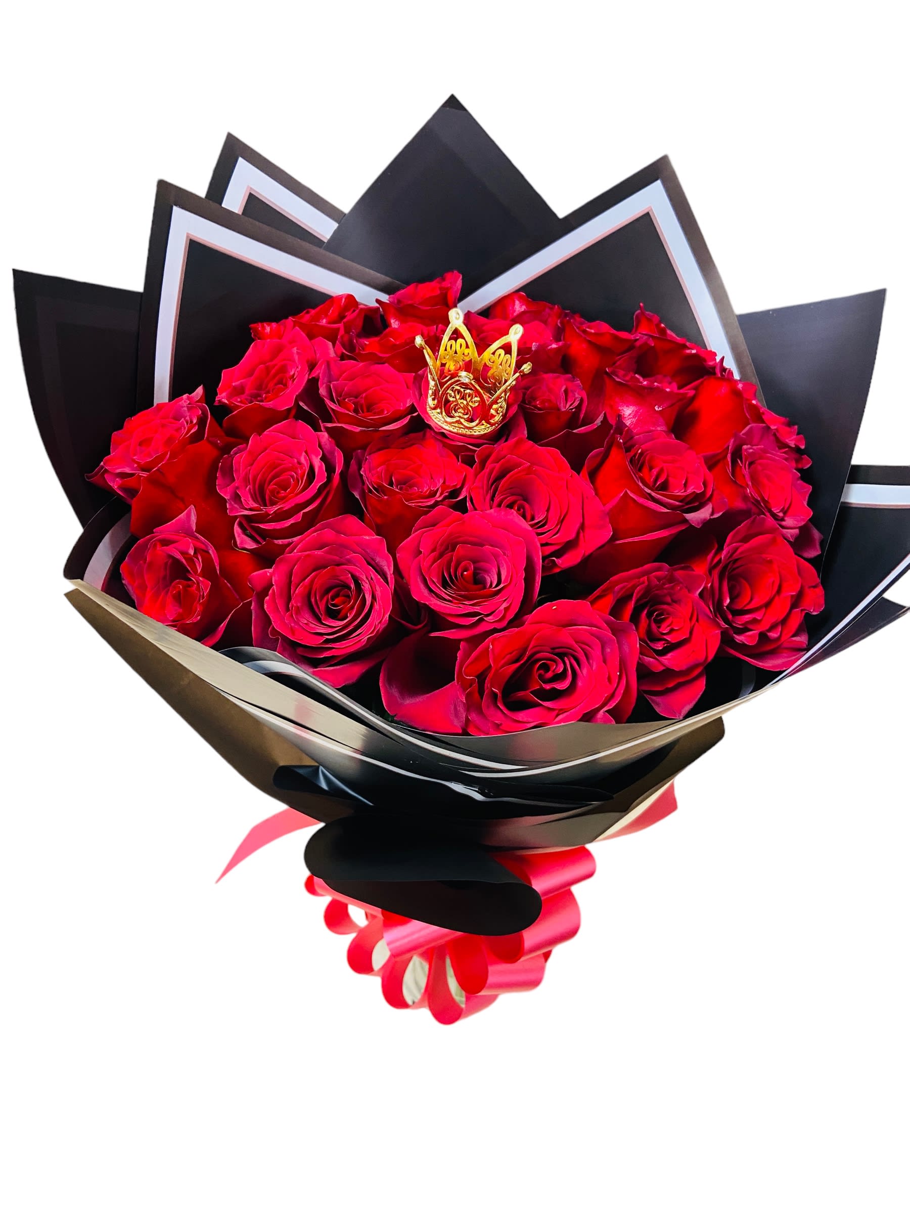 Bouquet of red roses wrapped in black paper with a gold crown accent