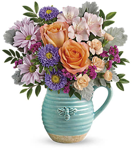 Teleflora's Busy Bee Pitcher Bouquet - Talk about buzz-worthy! Presented in a country-inspired and fabulously food-safe ceramic pitcher with petite bee motif, this cheerful bouquet of lush orange roses and pretty pink blooms is two gifts in one!