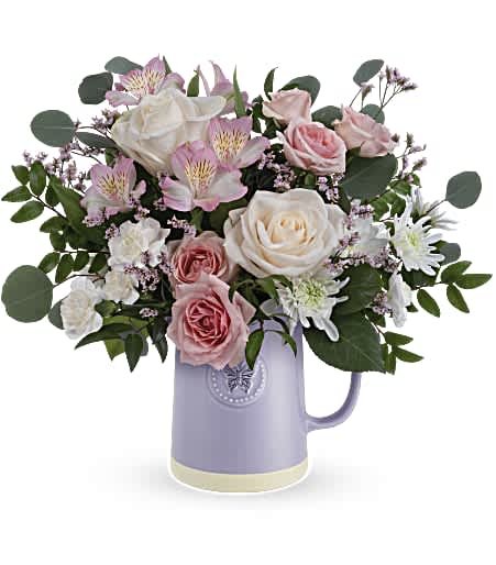 Teleflora's Blossom Delight Bouquet - Gift them timeless elegance with our Teleflora's Sweetest Flutter pitcher. This food-safe ceramic pitcher is adorned with an embossed butterfly and a soothing lavender finish, making it the perfect complement to a vibrant bouquet.