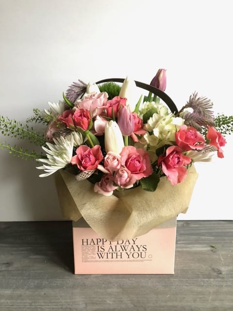 Pink and white mixed flower bouquet in a gift box