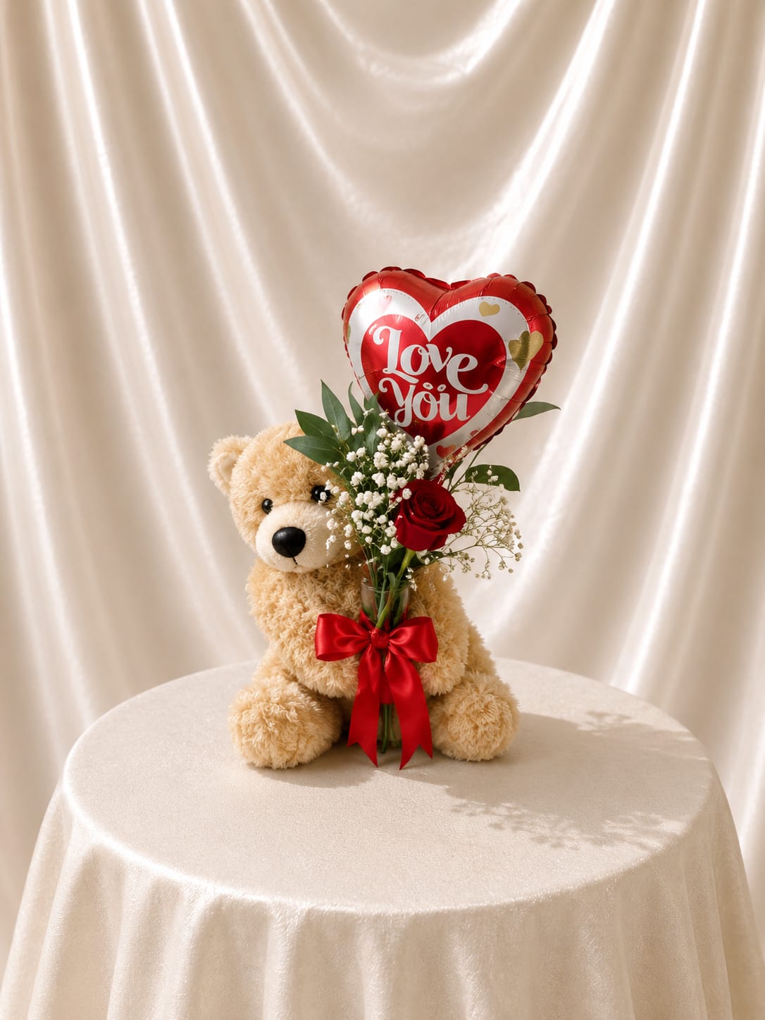 Teddy bear with a heart balloon and red rose bouquet