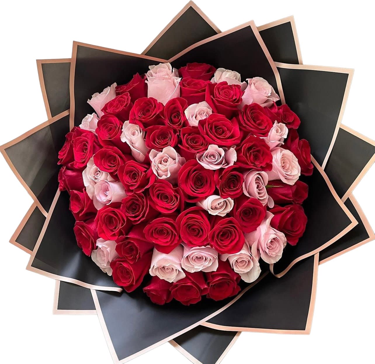 Bouquet of red and pale pink roses wrapped in black paper