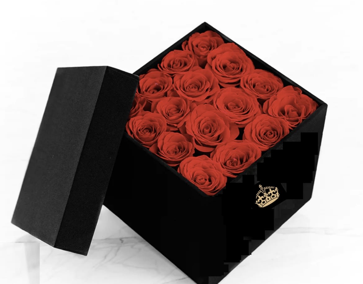 Black gift box filled with red roses