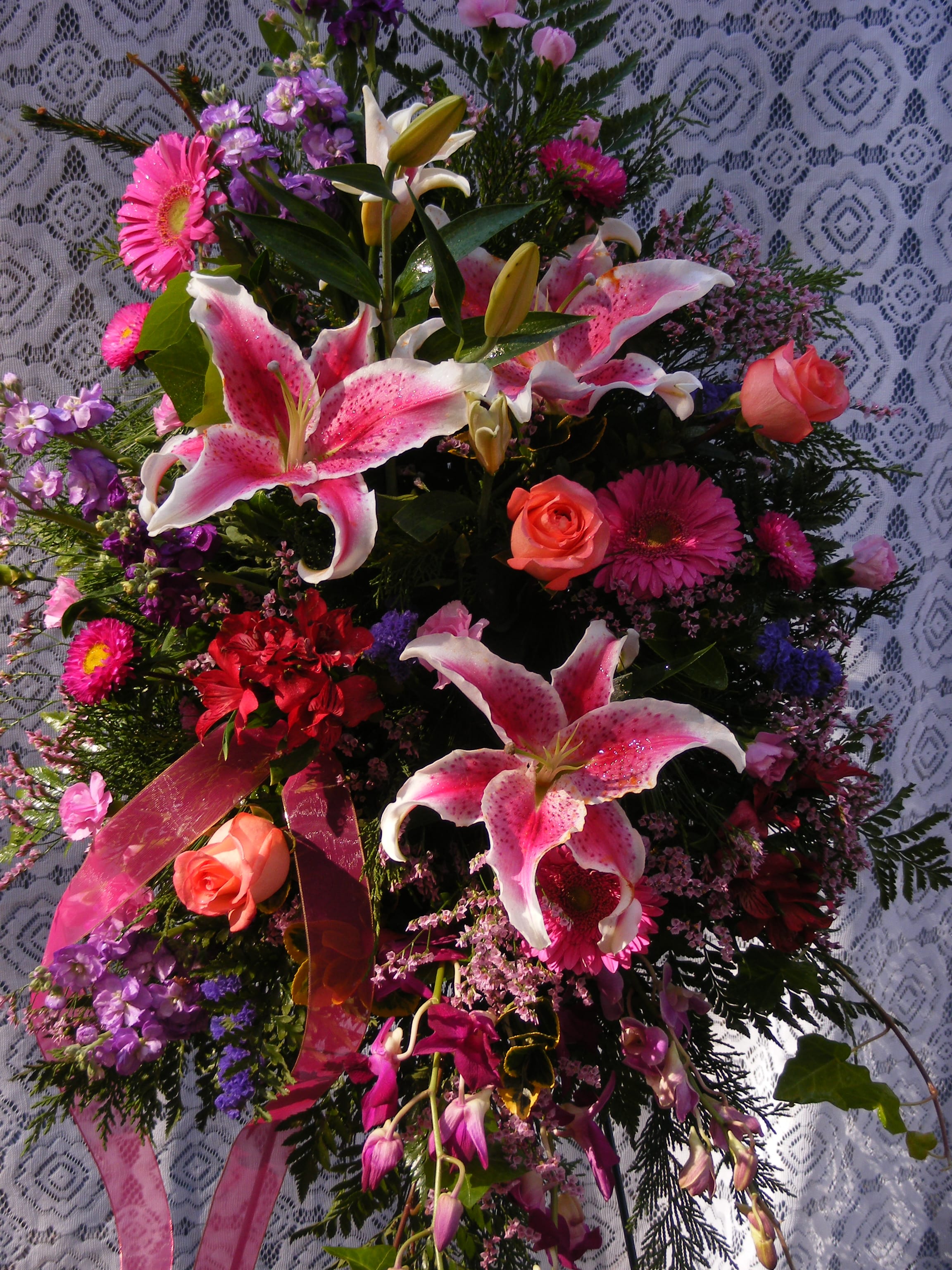 Pink and white lily bouquet with roses and purple flowers