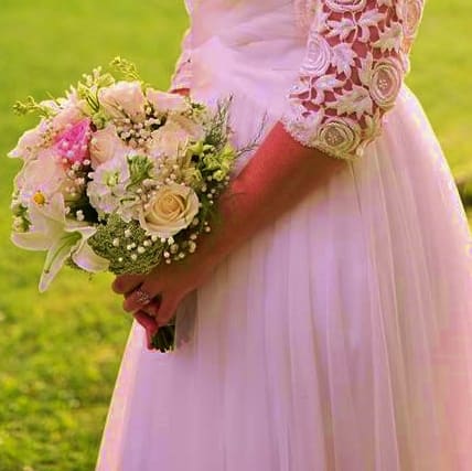 Bride holding a white and pink bouquet
