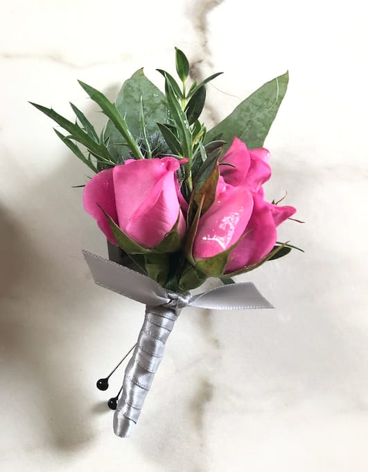 Pink rose boutonniere with silver ribbon wrap