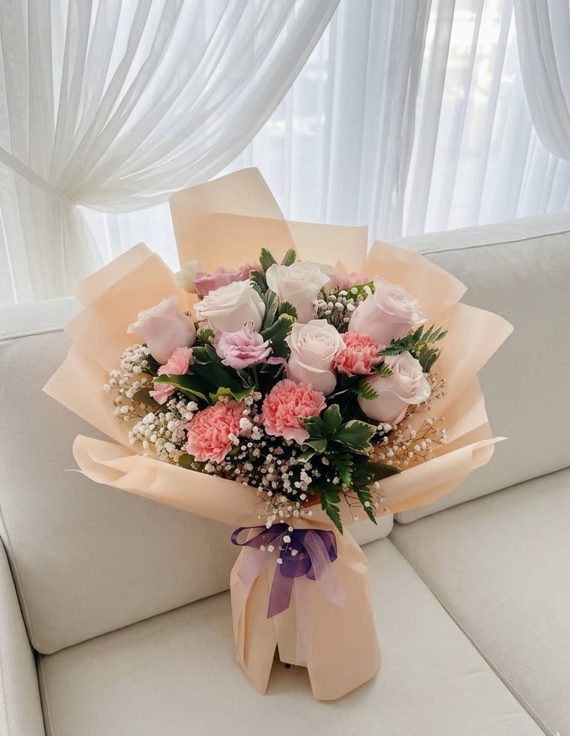 Apricot Dream - Romantic Pink Rose &amp; Carnation Bouquet - A romantic Korean-style bouquet featuring premium soft pink roses, bicolored pink lisianthus, and vibrant pink carnations. Accented with delicate white baby's breath and lush greenery, this bouquet is elegantly wrapped in apricot-toned paper and finished with a purple ribbon.  