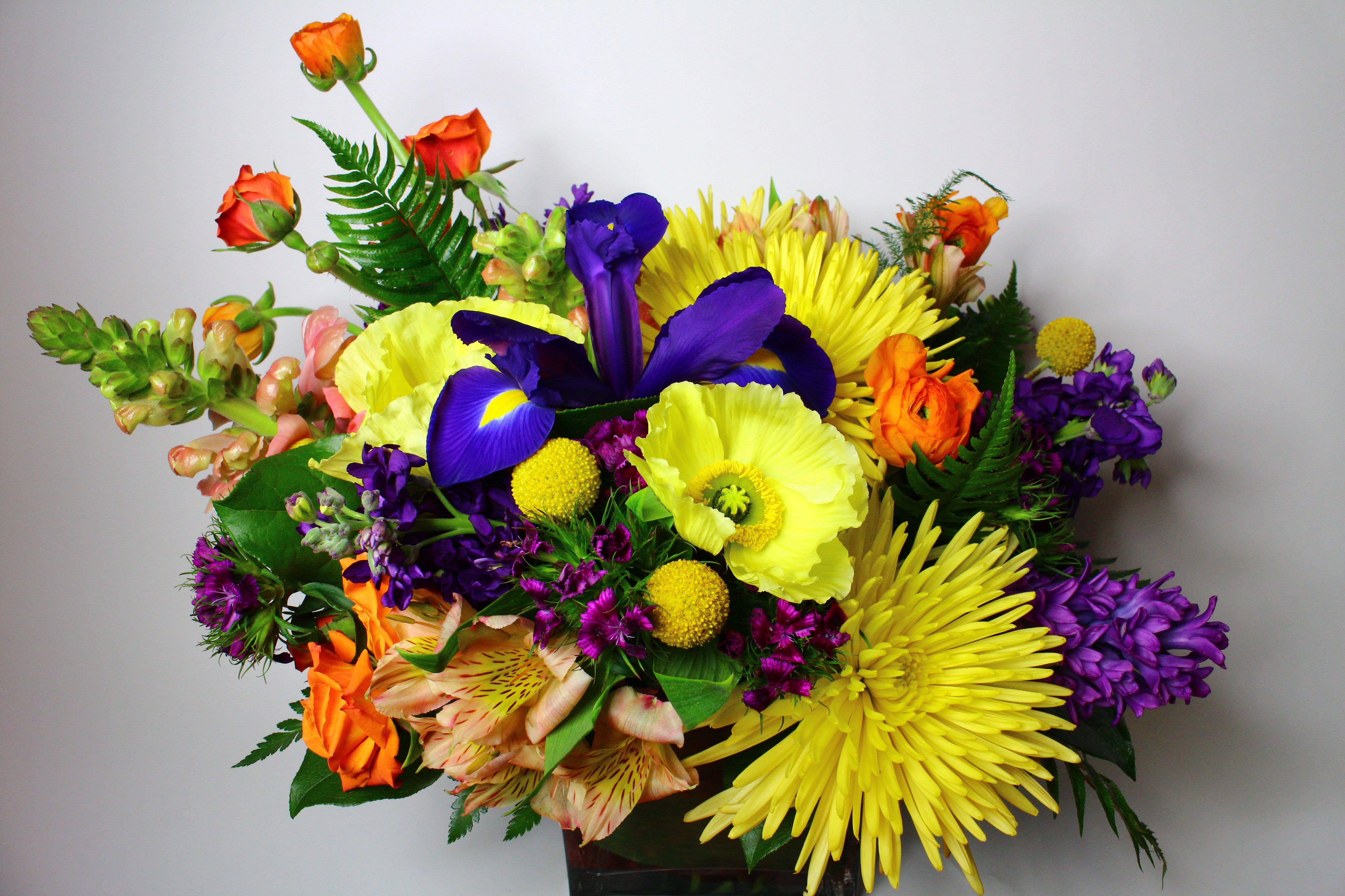 Colorful bouquet with yellow, purple, orange, and pink flowers