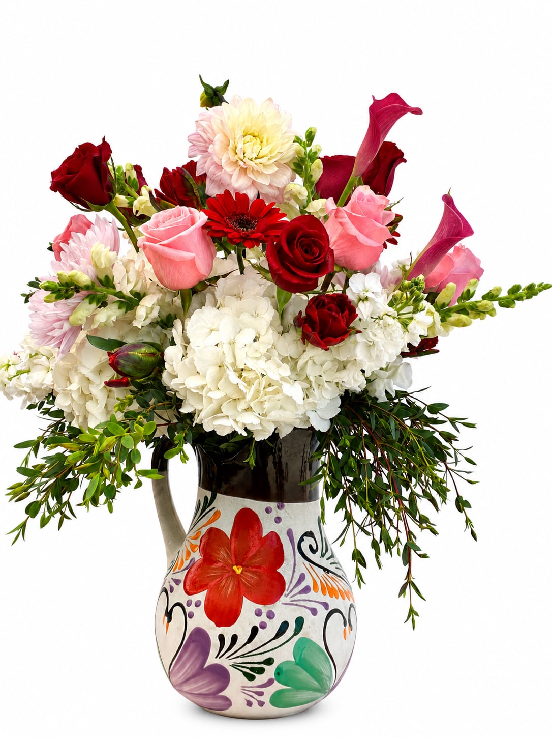 Amor En Flores - A luxurious garden style featuring roses, hydrangea’s,calla lilies, tulips and other season blooms.designed in a hand painted pitcher.