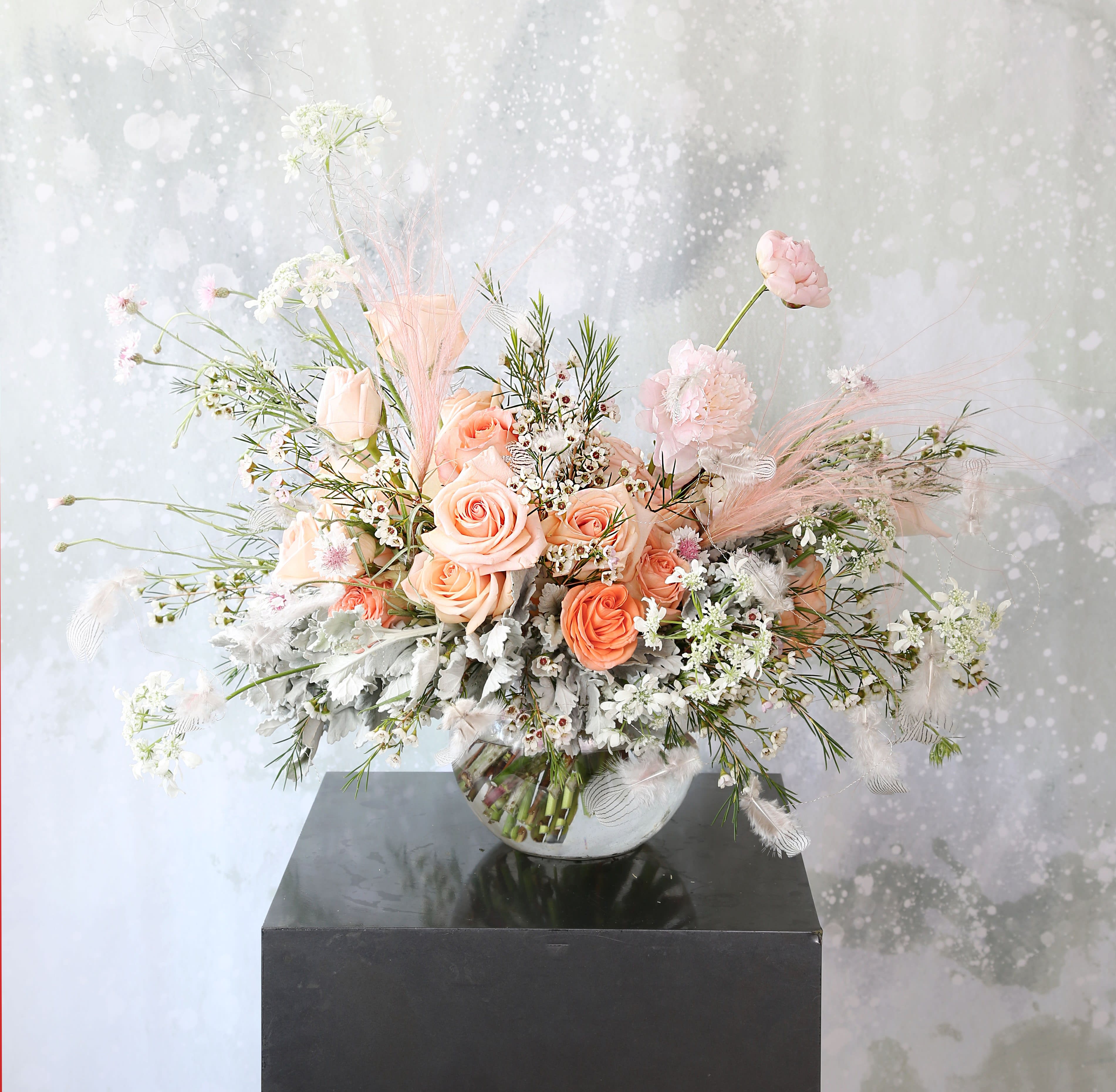 Peach Tendor - A peach Blush Ivory color palette create by Garden rose, peonies, seasonal wild flower bloom bring us a very soft and calm meditation energy. This bouquet decor by feather garland. Hand tie bouquet wrap with ribbon with 8' round vase and packed with our branded gift box Disclaimer: Photo just represent the overall style, look and feel, which may not be able to identically replicate in some instance. We will only substitute item of equal value or higher value. 