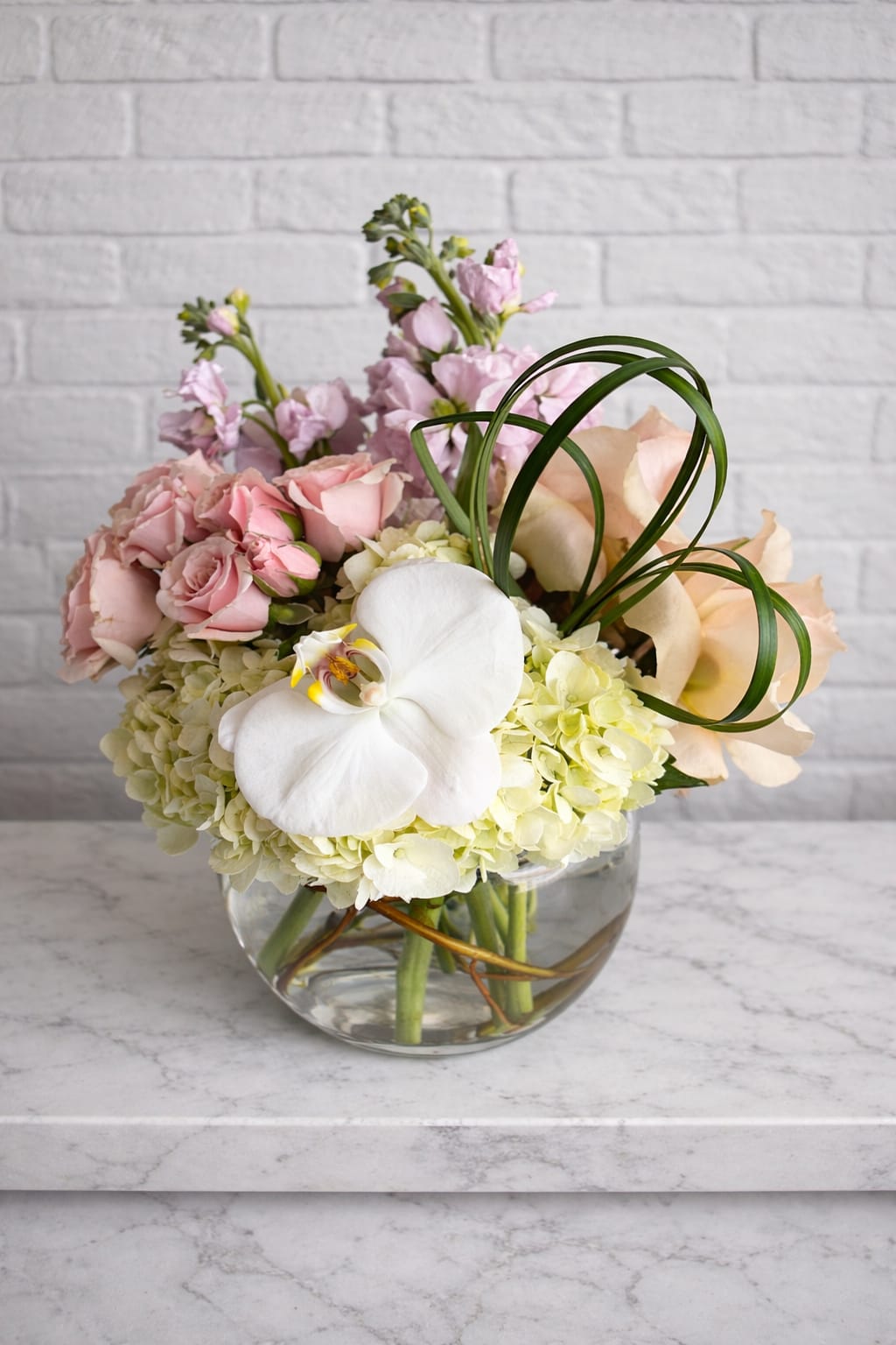 Loire - Additional blooms will be added, and arrangement will be in a bigger vase. 