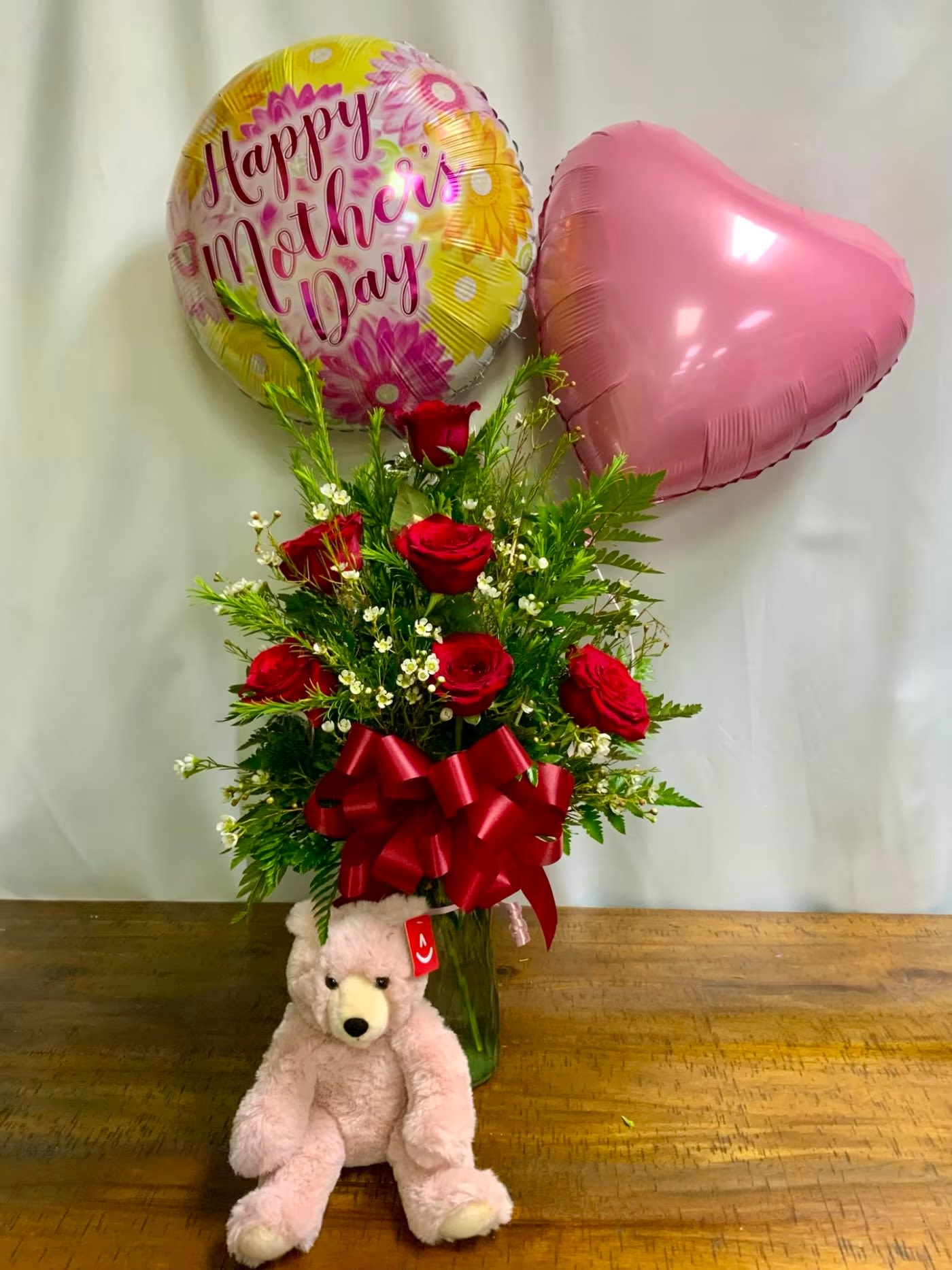 Half Dozen Mothers Day Combo - 6 Rose arrangement with 2 Mylar balloons and an adorable teddy bear. You may choose the color of roses.