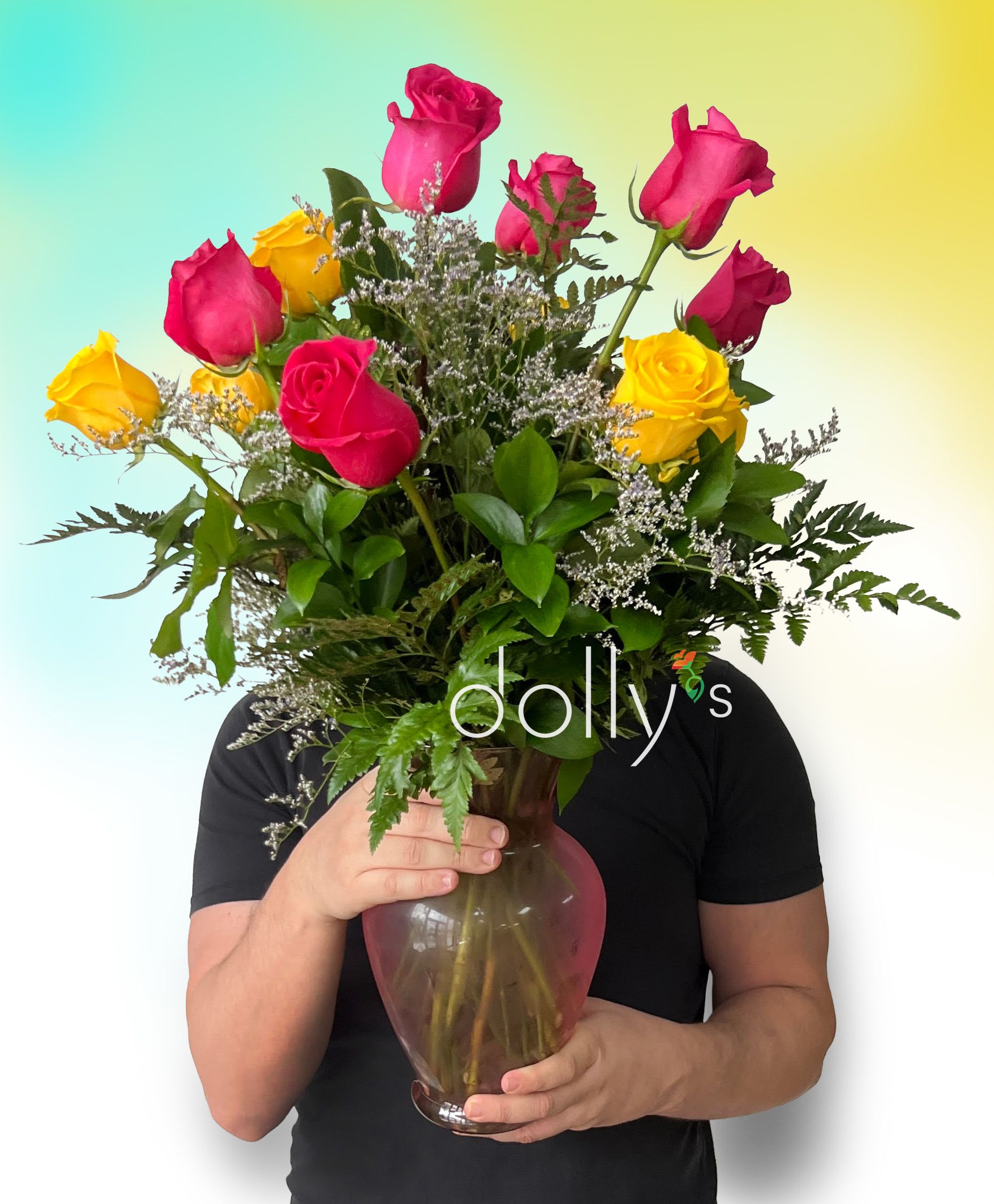 Bouquet of pink and yellow roses in a glass vase