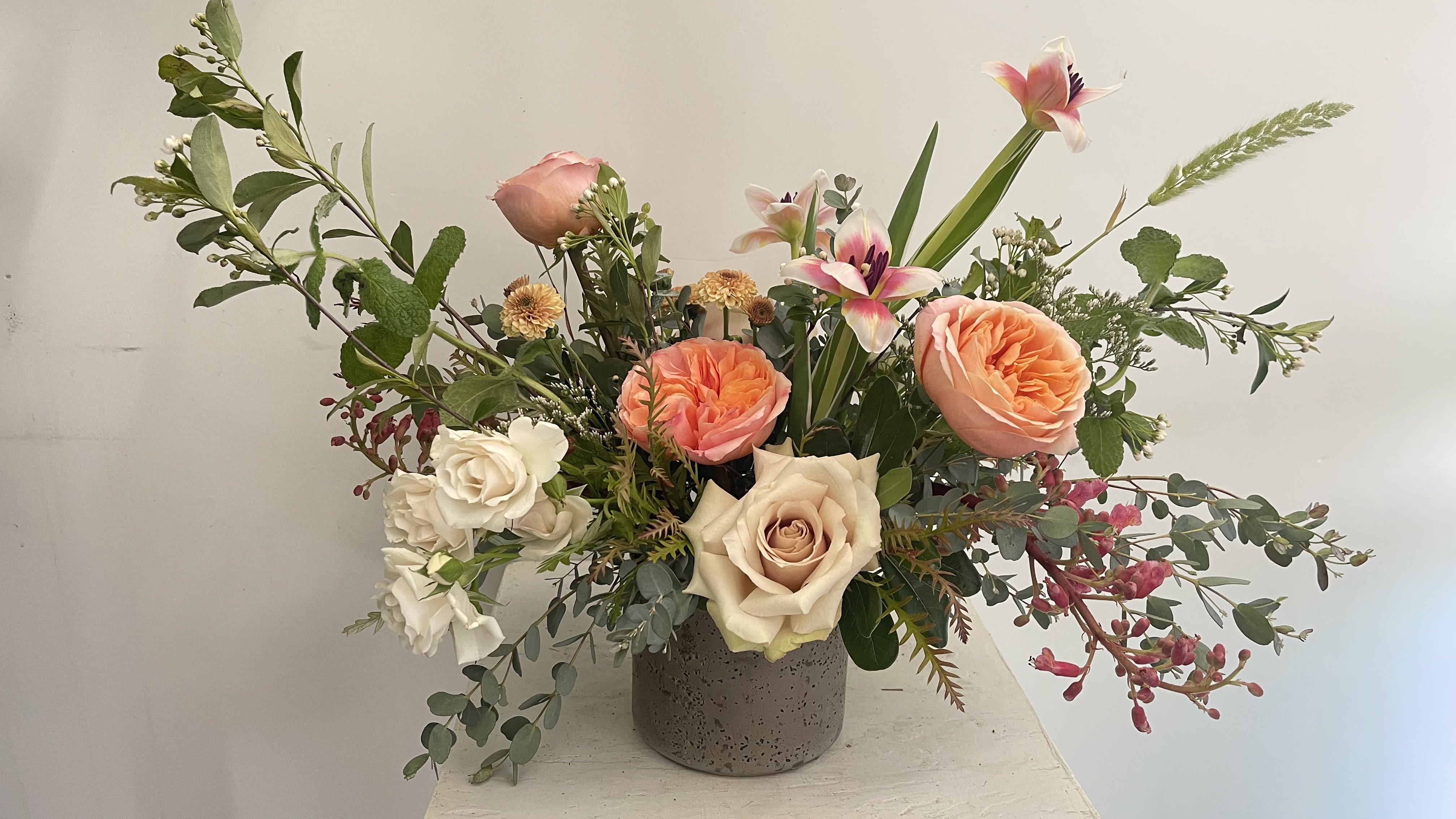 Versace  - Flemish design in a clay pot filled with garden roses and tulips. 