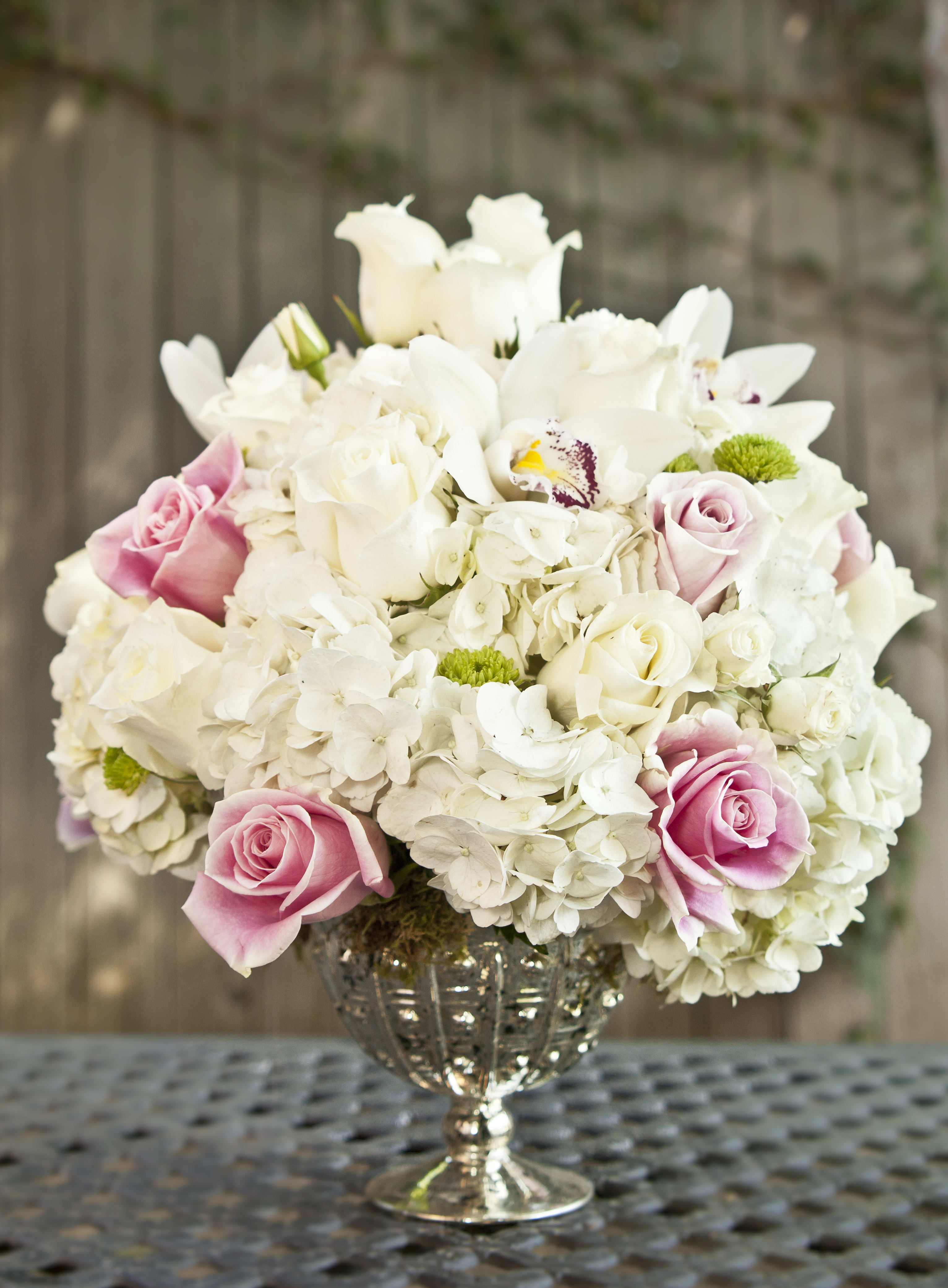 Pink and white rose bouquet in a silver vase