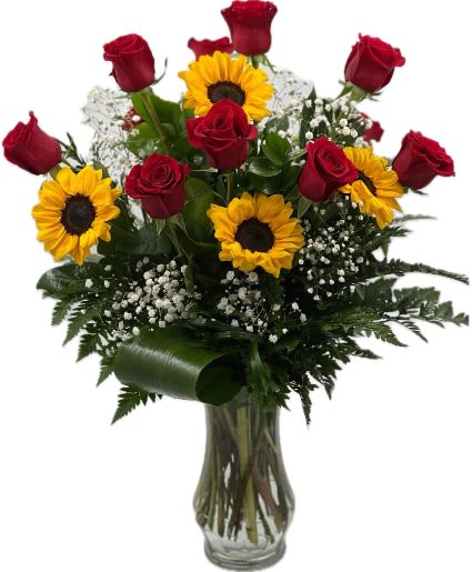 Bouquet of red roses and sunflowers in a clear glass vase