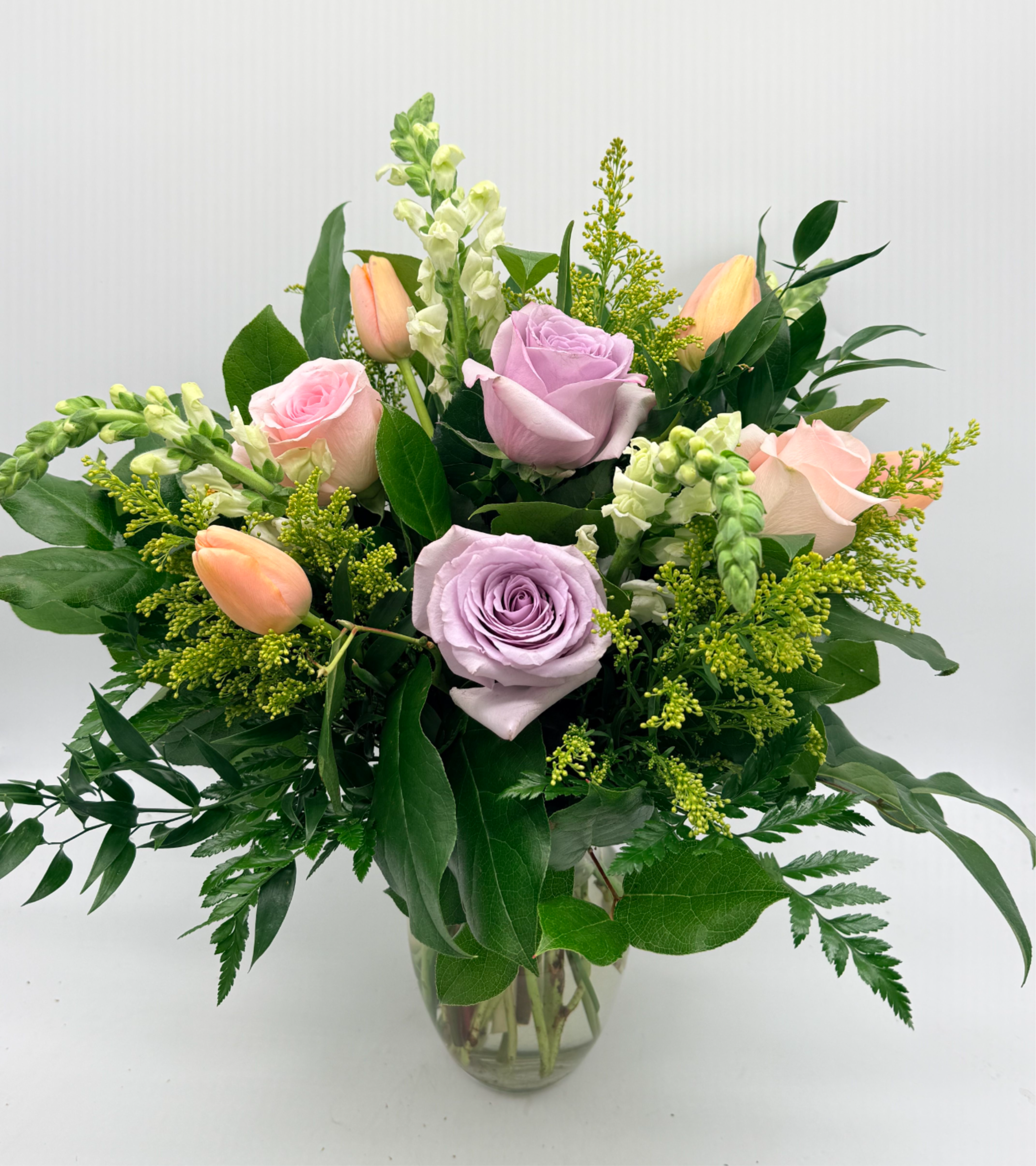 Rosy Tulips  - A sweet and stylish mix of roses, tulips, and fresh seasonal blooms. Flower types and shades may vary depending on availability.