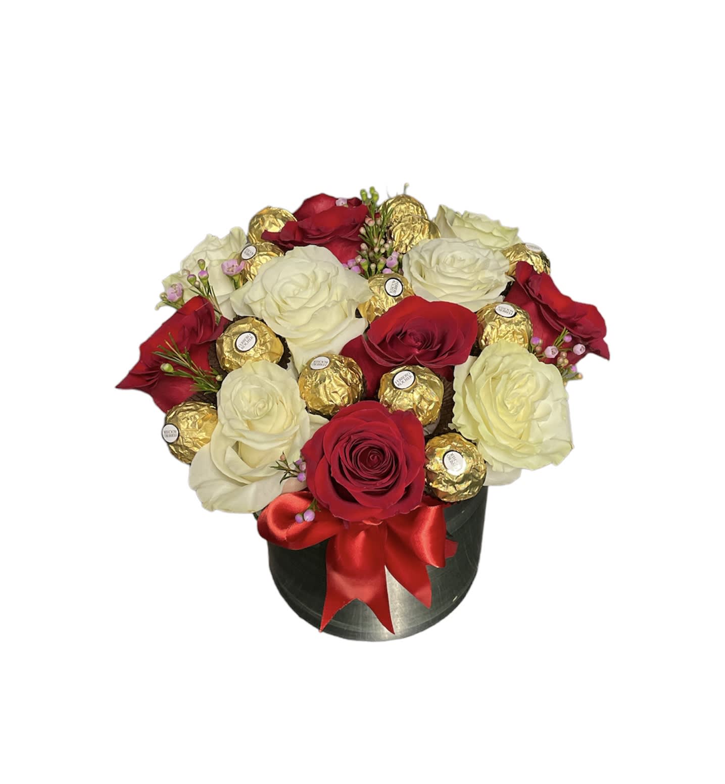 Round box arrangement of red and white roses with gold-wrapped chocolates and red bow