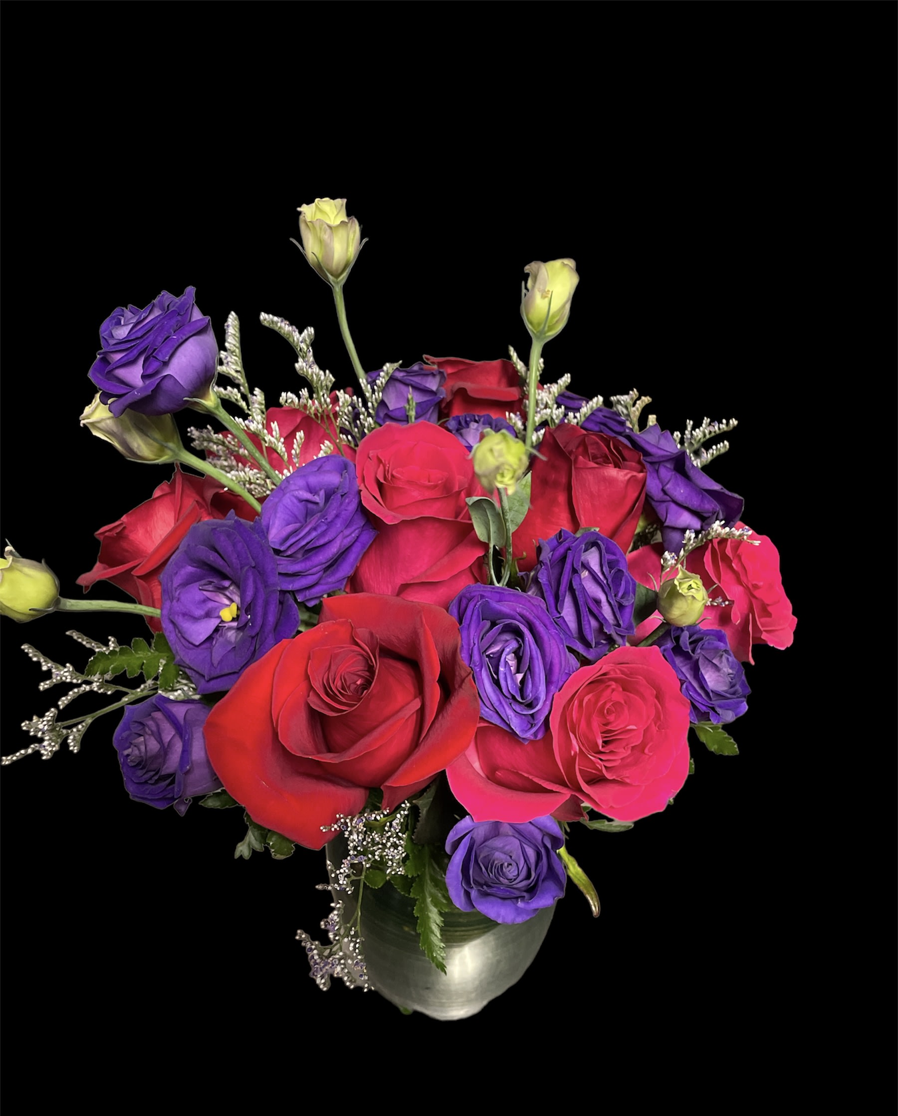 Bouquet of red and purple roses in a silver vase