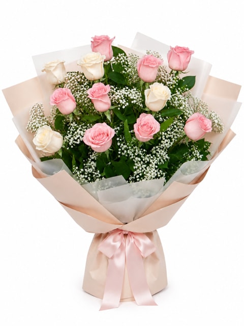 Dozen  Soft Pinks Wrapped Bouquet - Long stem white and pink roses with baby's breath and greens perfect for any occasion. Will come wrapped approximately as shown depending on paper availability.