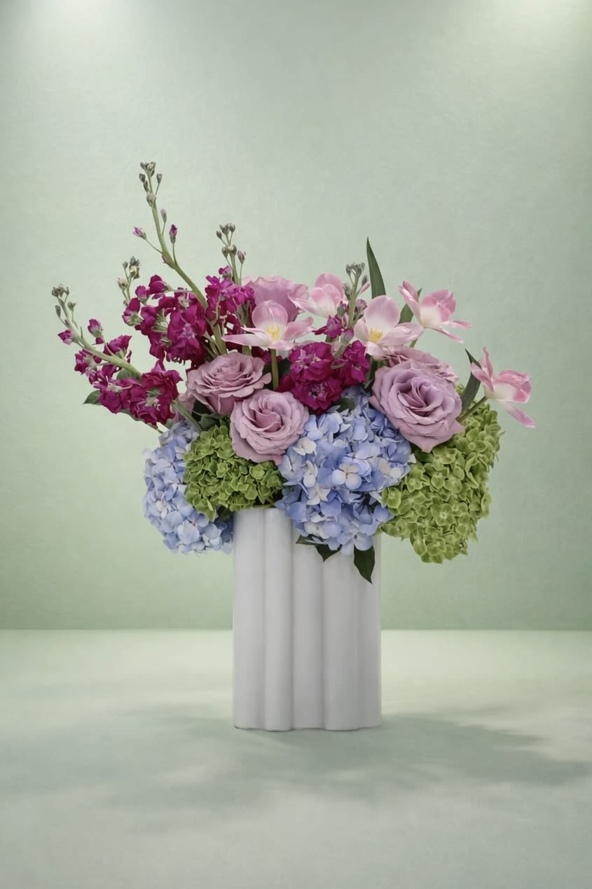 Radiant Medley - Fresh hydrangeas, roses, and stock come together in the perfect celebratory surprise.