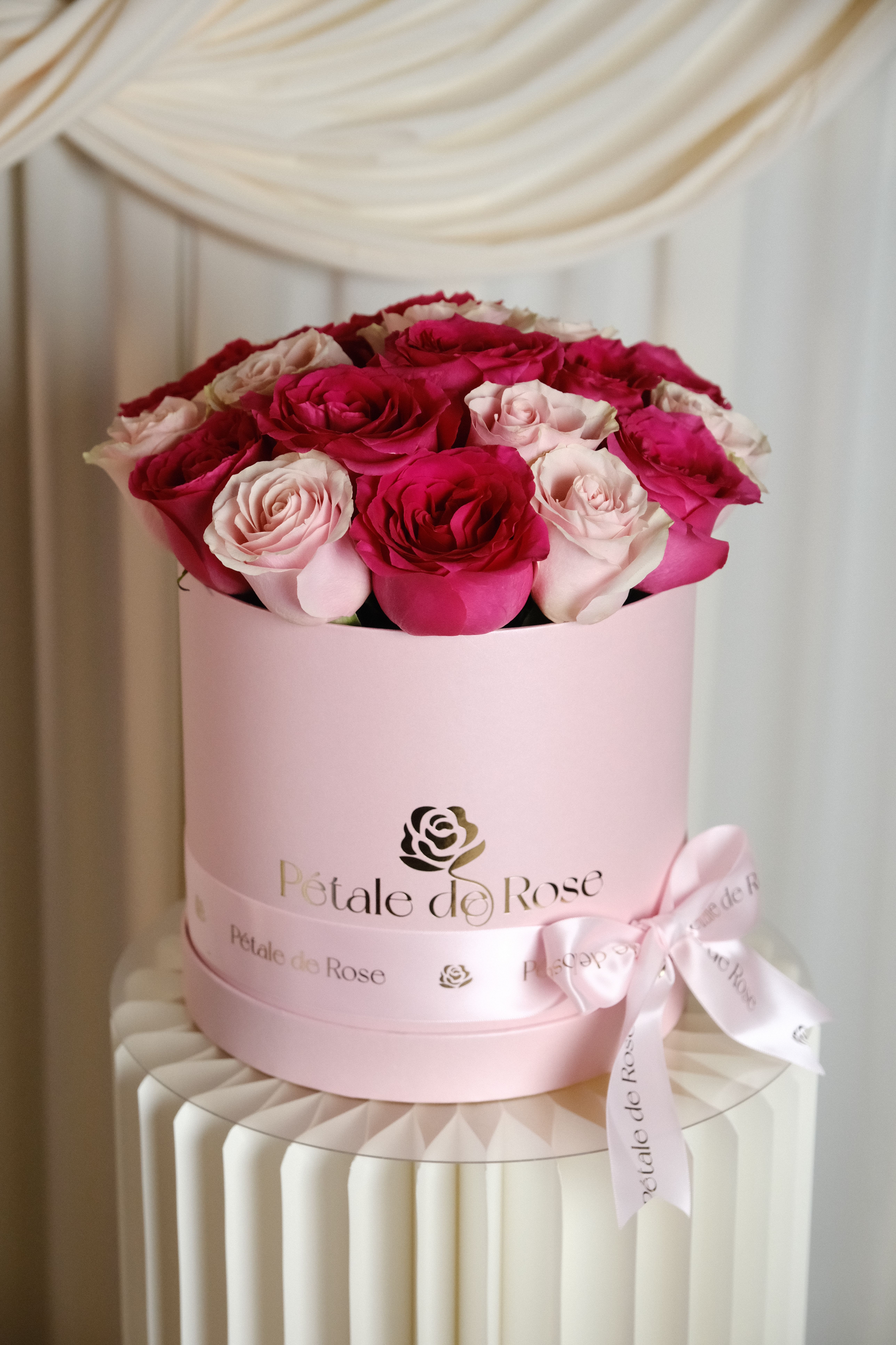 Stella - A romantic arrangement featuring premium pink and blush roses carefully designed in our signature new hat box.  Soft, feminine, and elegant, this floral design is perfect for celebrating Mother’s Day with beauty and grace.  Please note: Flower substitutions and shades may vary based on seasonal and market availability. Our designers will always maintain the overall color palette, freshness, style, and luxurious feel of the arrangement shown.
