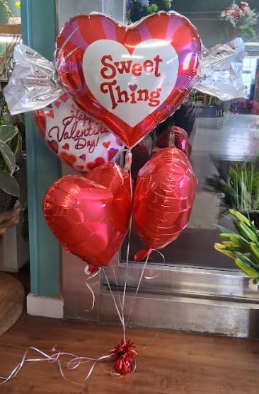 Heart-shaped Valentine balloons with red and silver foil balloons