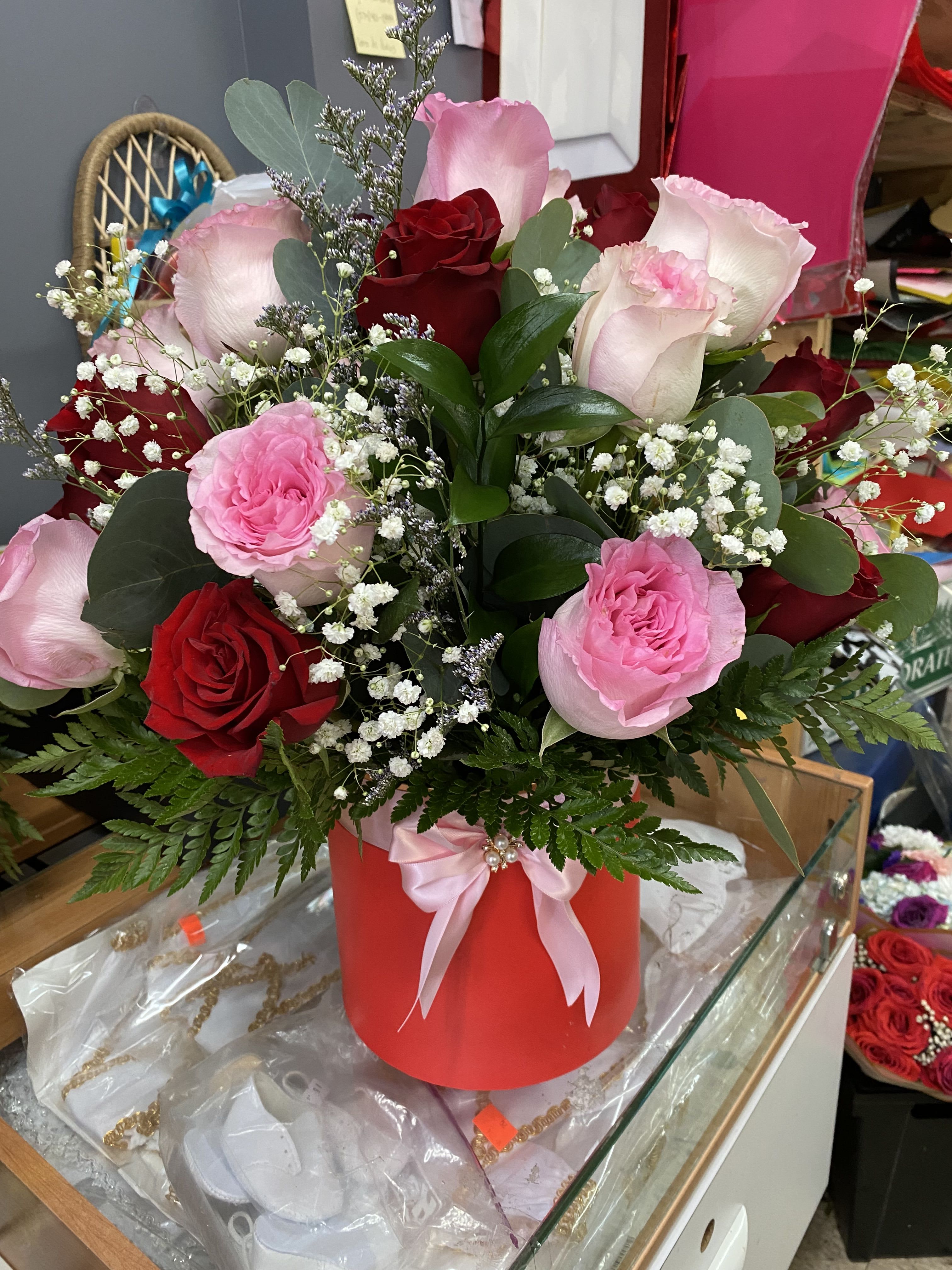 Cylinder box - 25. Red and pink roses with white babies breath in a cylinder Box