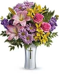 Springtime Remembrance Sympathy Arrangement - A bright and thoughtful sympathy arrangement designed in a silver cross keepsake vase. This elegant tribute features florist-choice seasonal blooms in soft spring colors, thoughtfully accented with fresh greenery to create a balanced and uplifting display.  Perfect for honoring a cherished life or expressing heartfelt sympathy, the combination of vibrant spring hues with the lasting silver cross keepsake offers a meaningful and comforting tribute. 