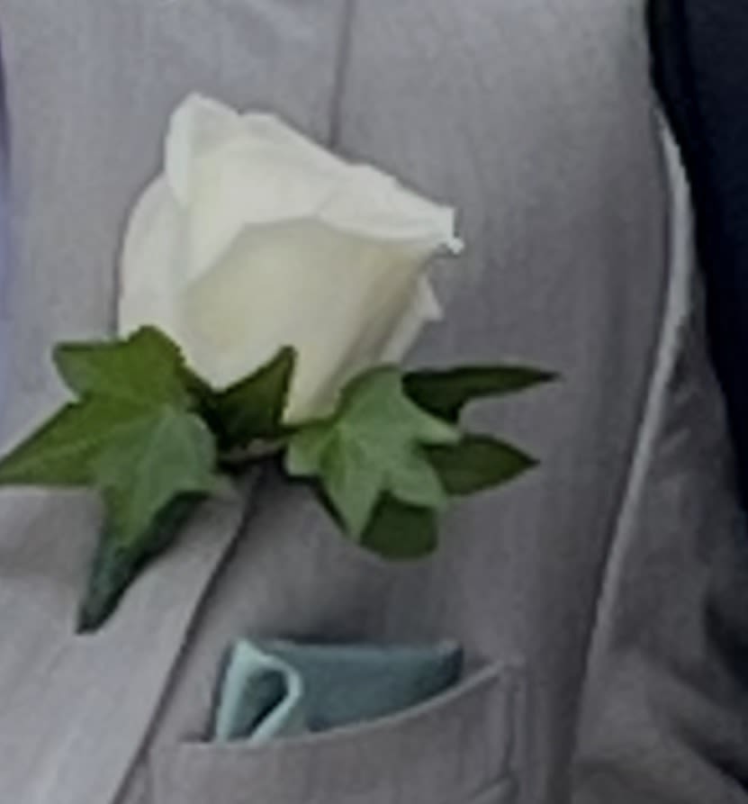Boutonniere - Flower to wear to a special event. Let us know the colors being worn and we can help you pick a complimentary flower for your Boutonniere!
